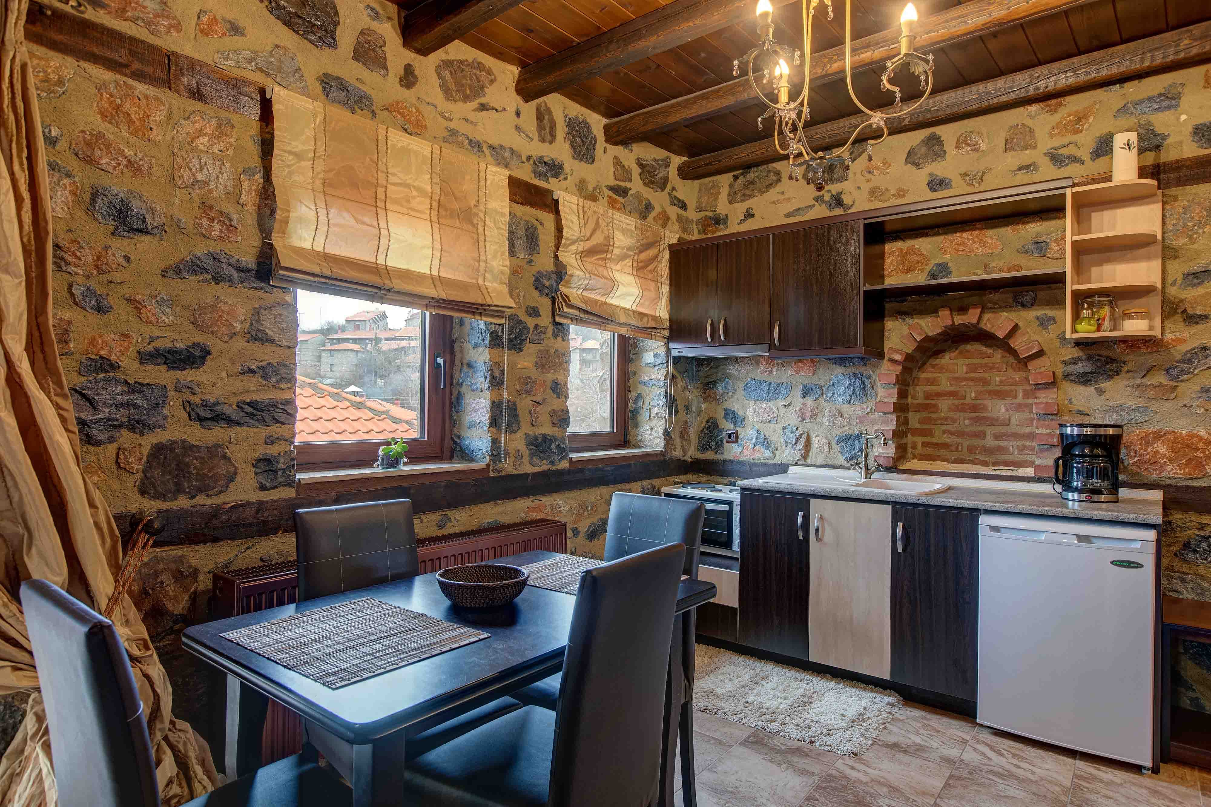 a kitchen with a table and chairs
