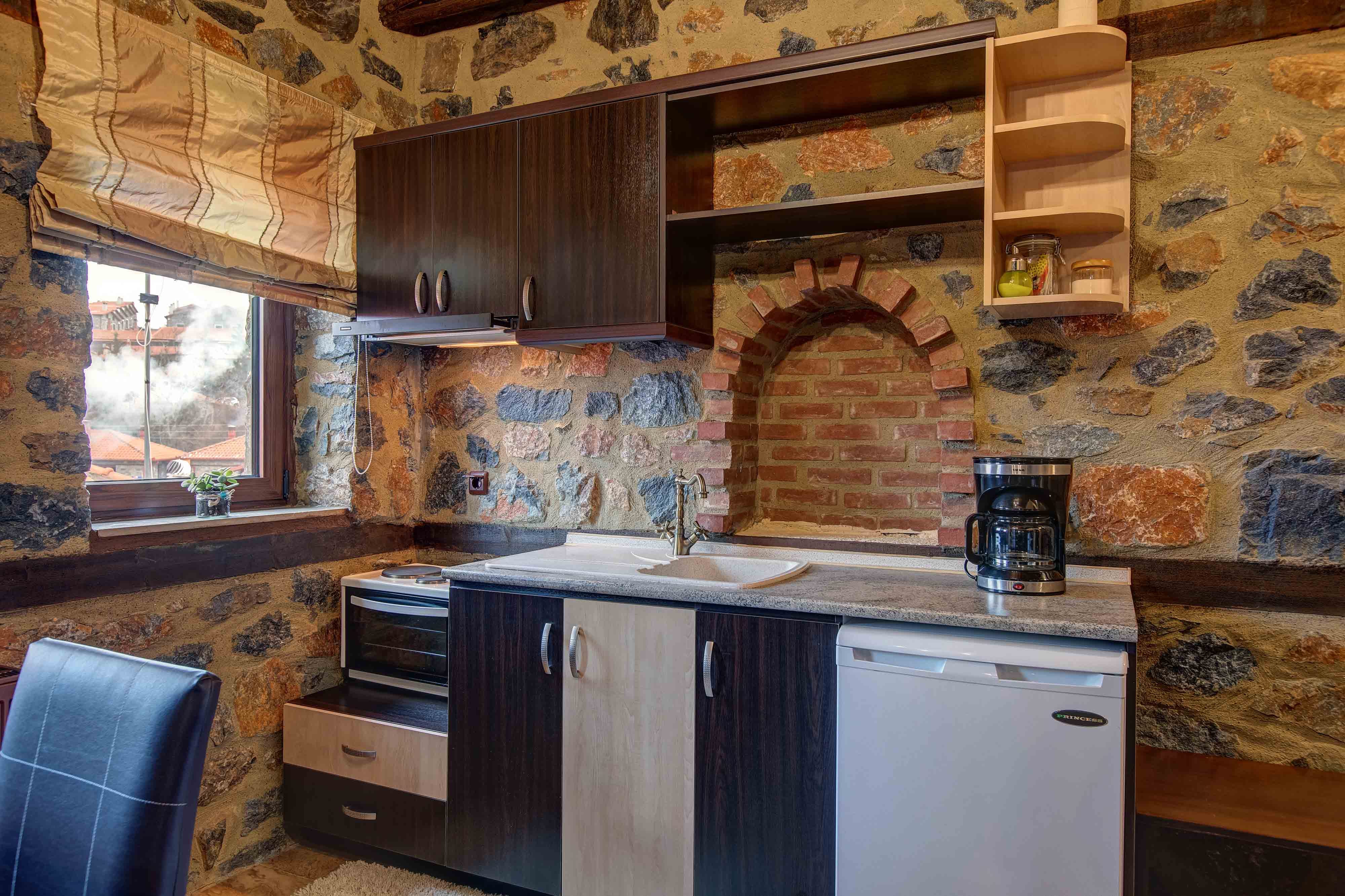 a kitchen with a brick wall