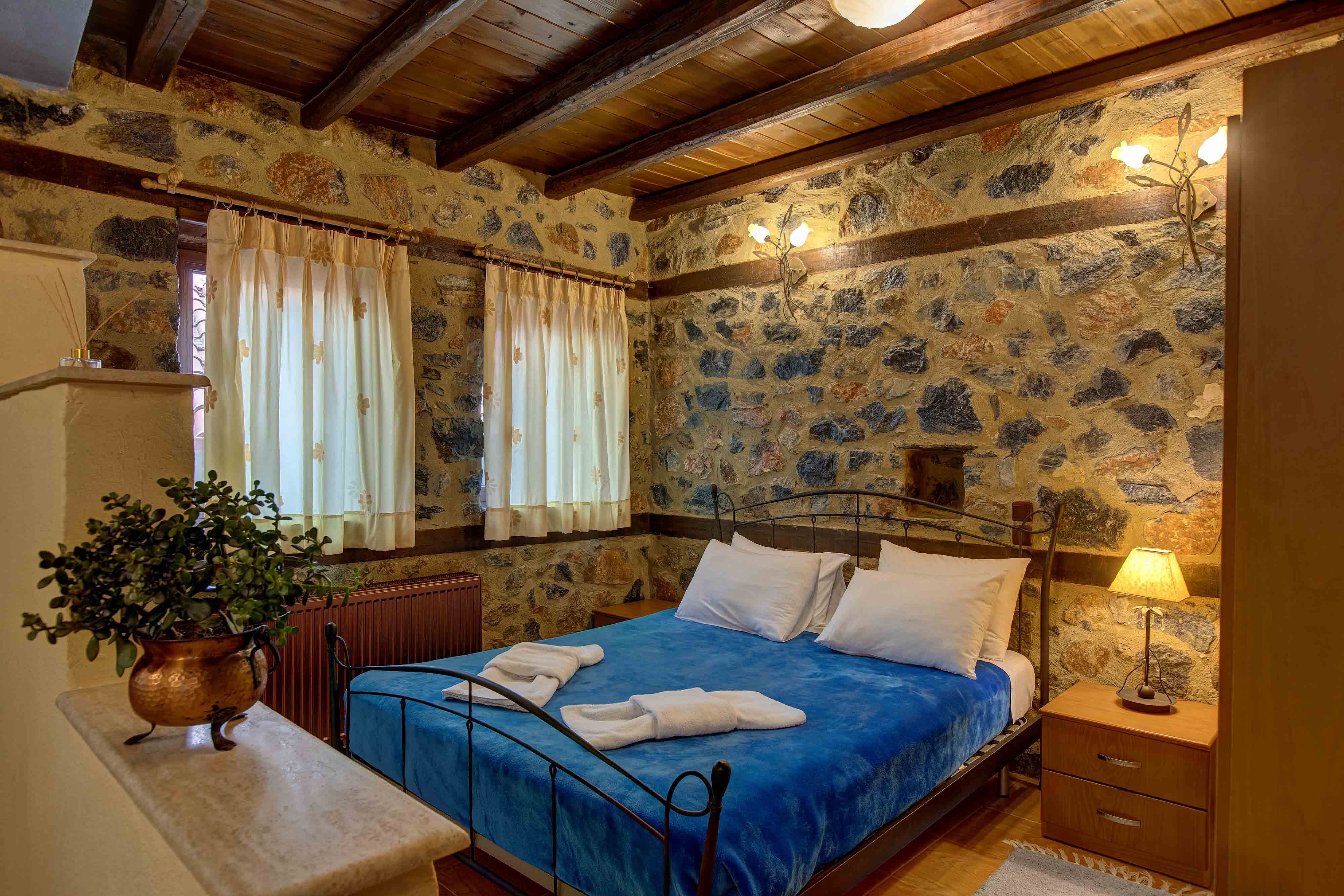 a bedroom with a bed and a plant