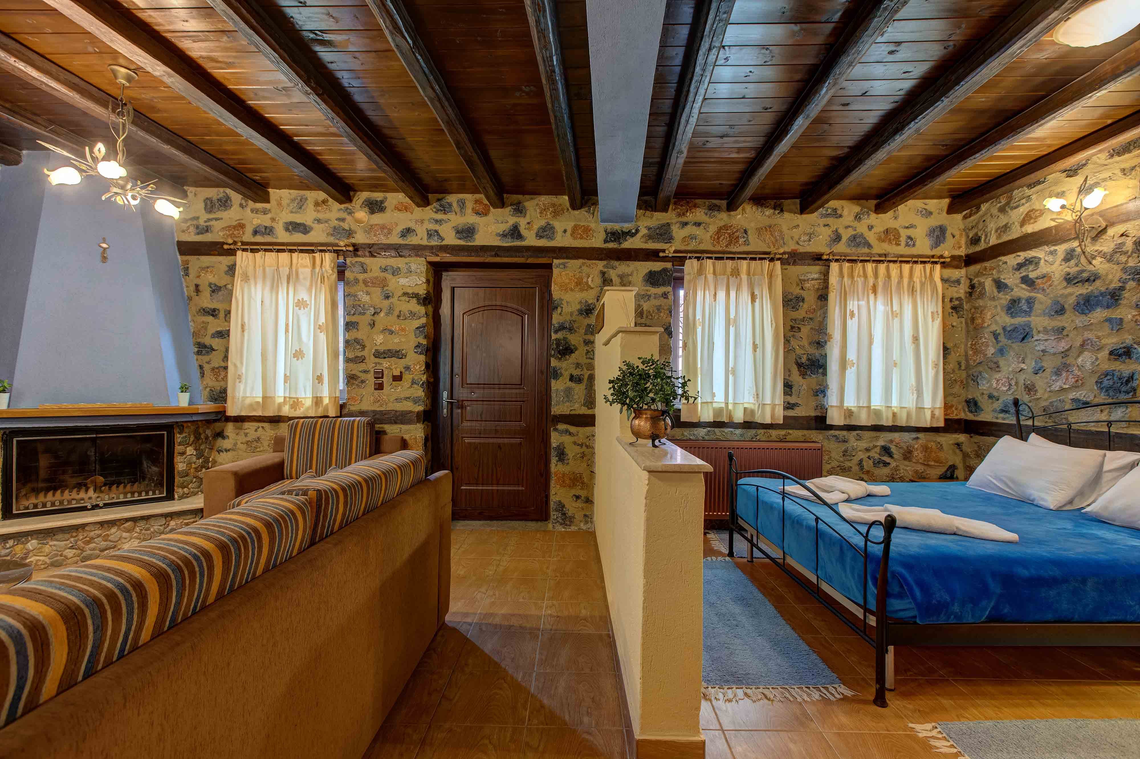 a room with a bed and a fireplace