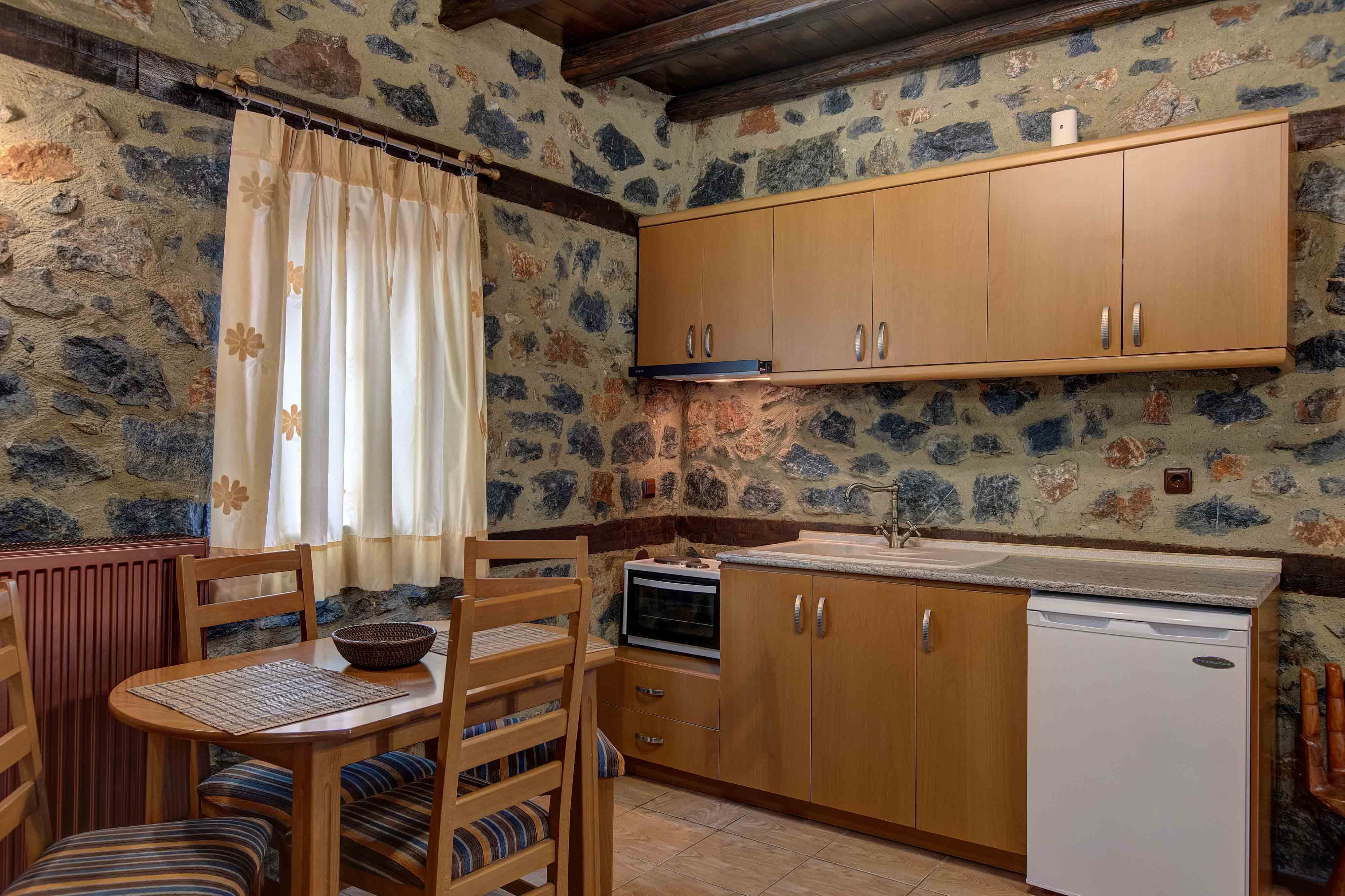 a kitchen with wooden cabinets