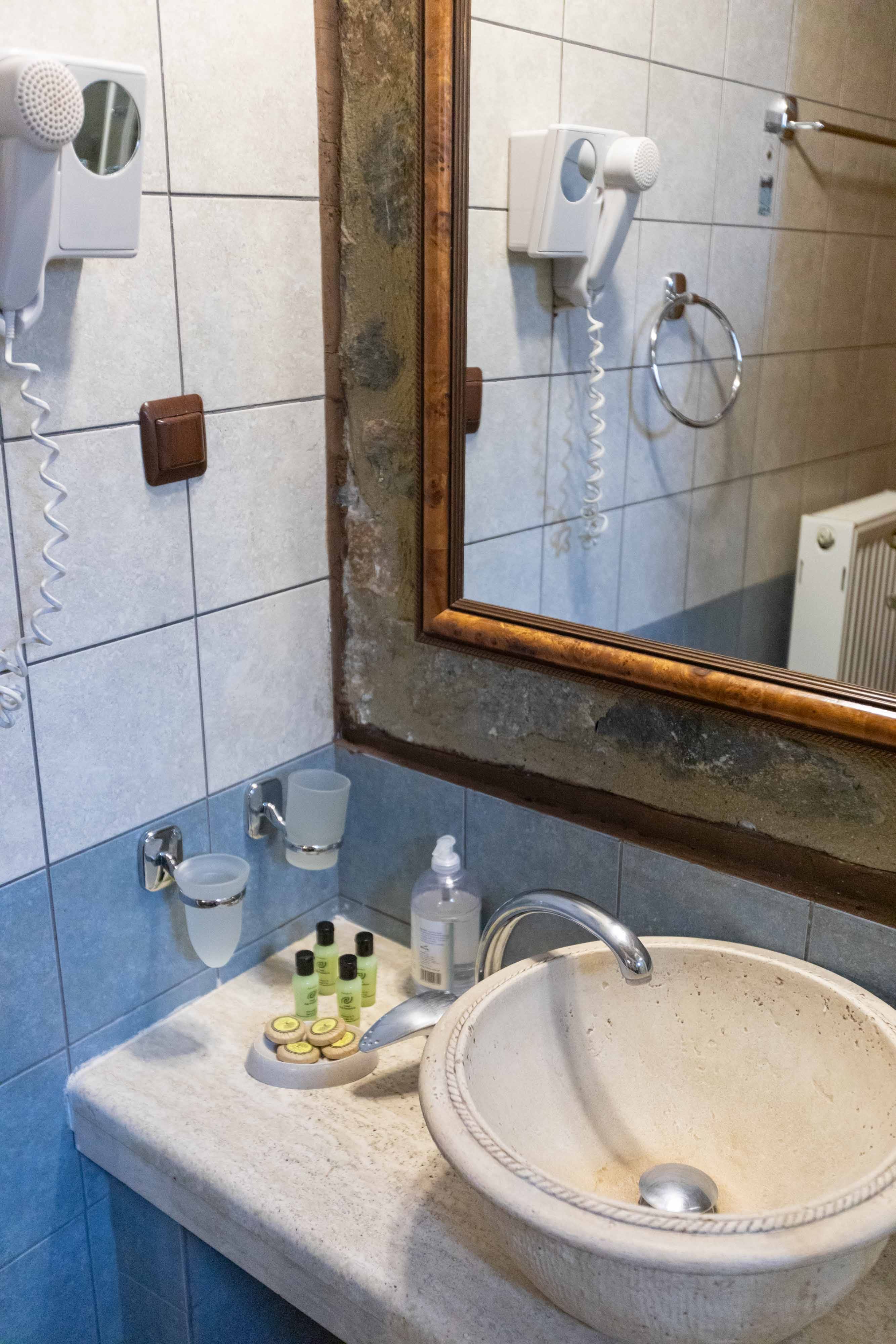 a bathroom with a mirror and sink