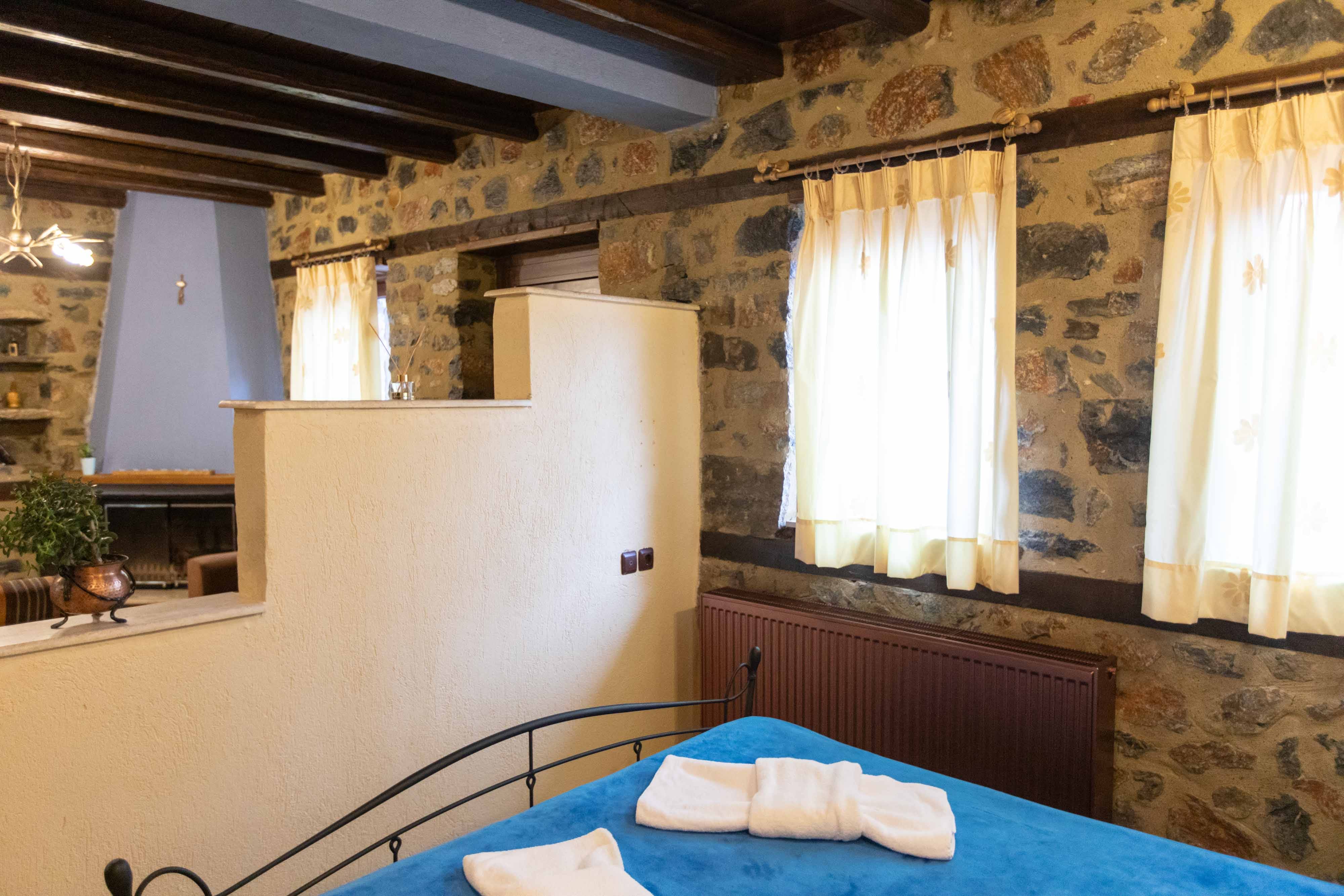 a bed with a blue bed spread