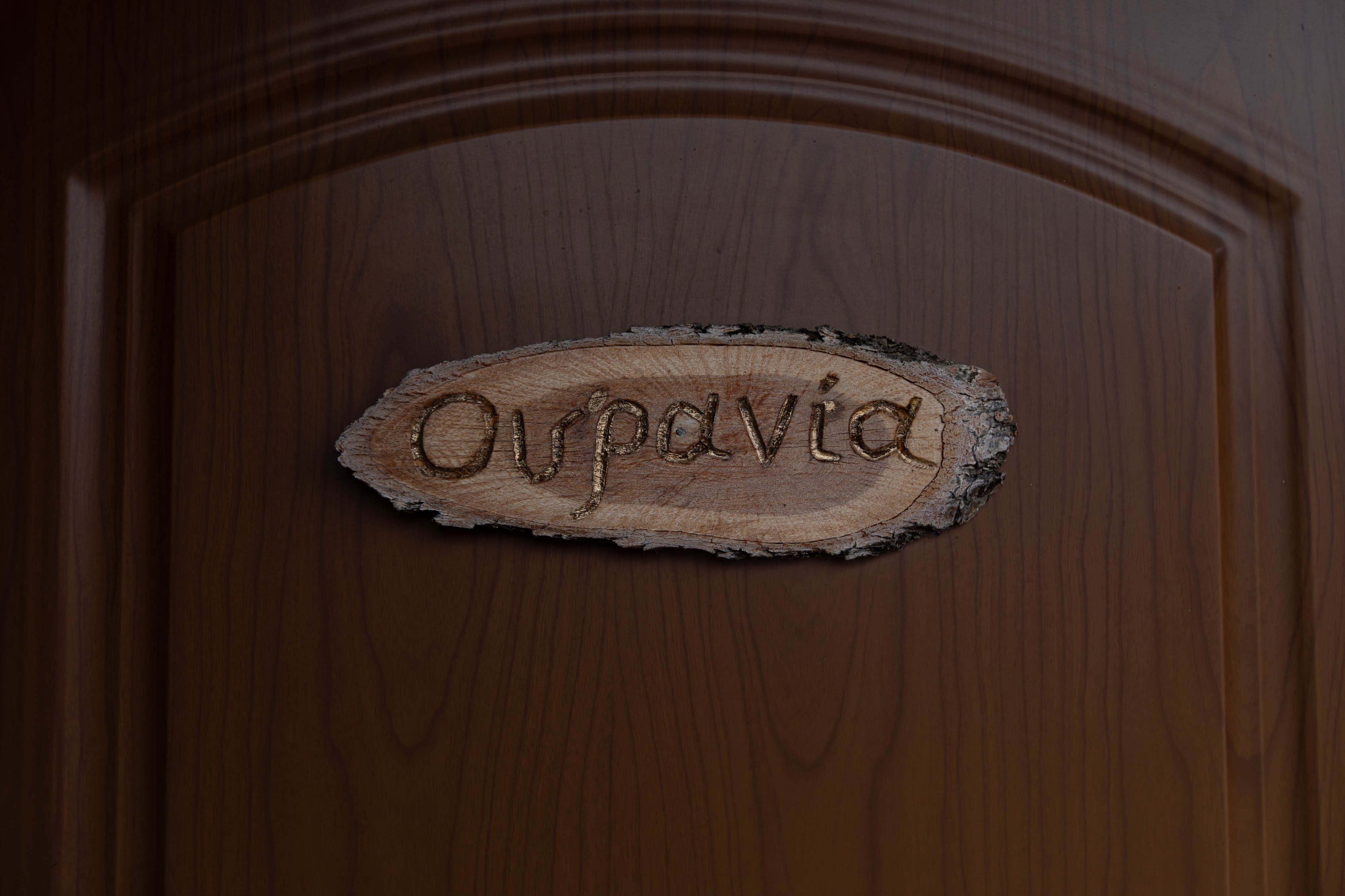 a wooden sign on a wall