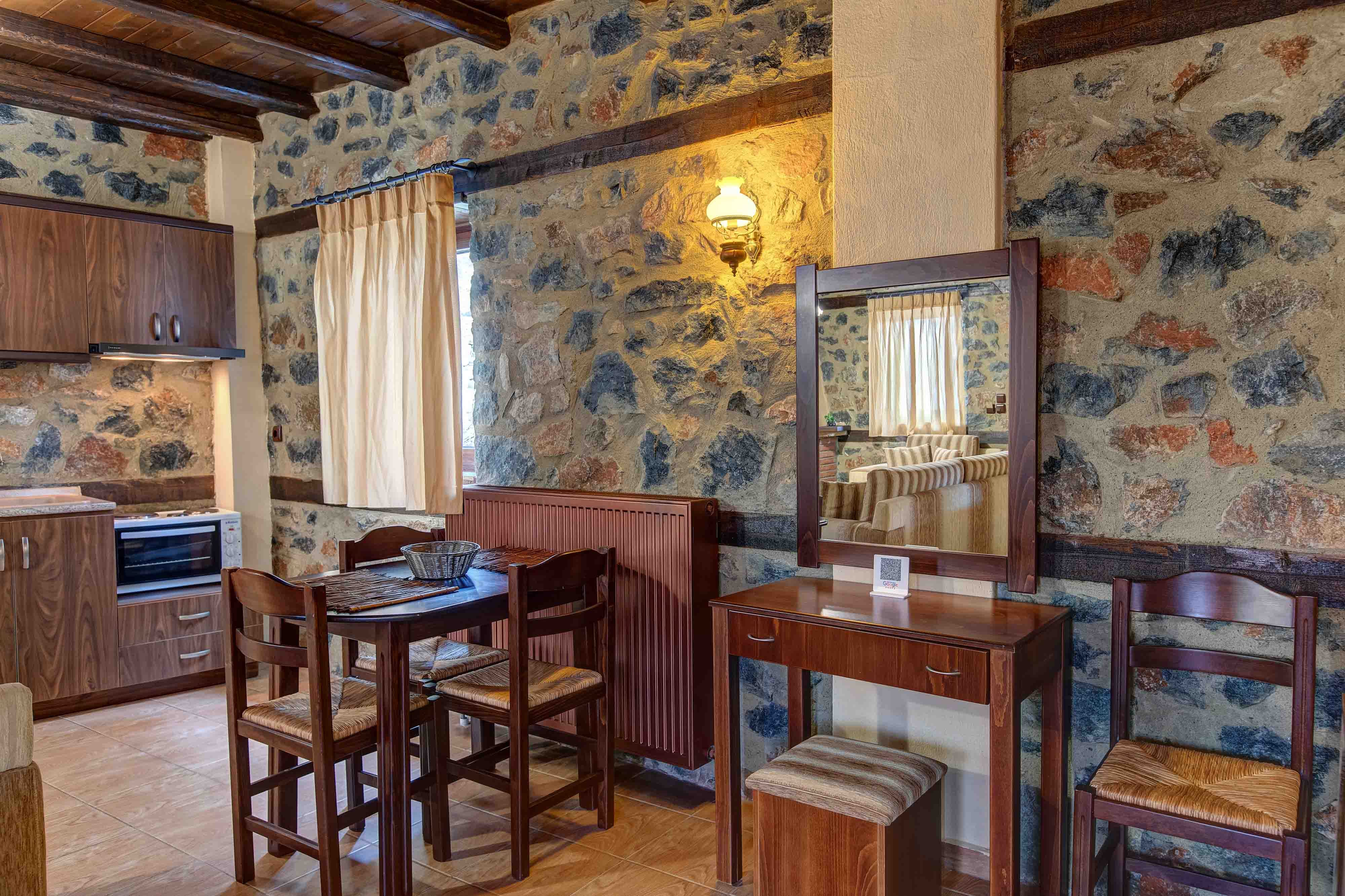 a room with a table chairs and a mirror