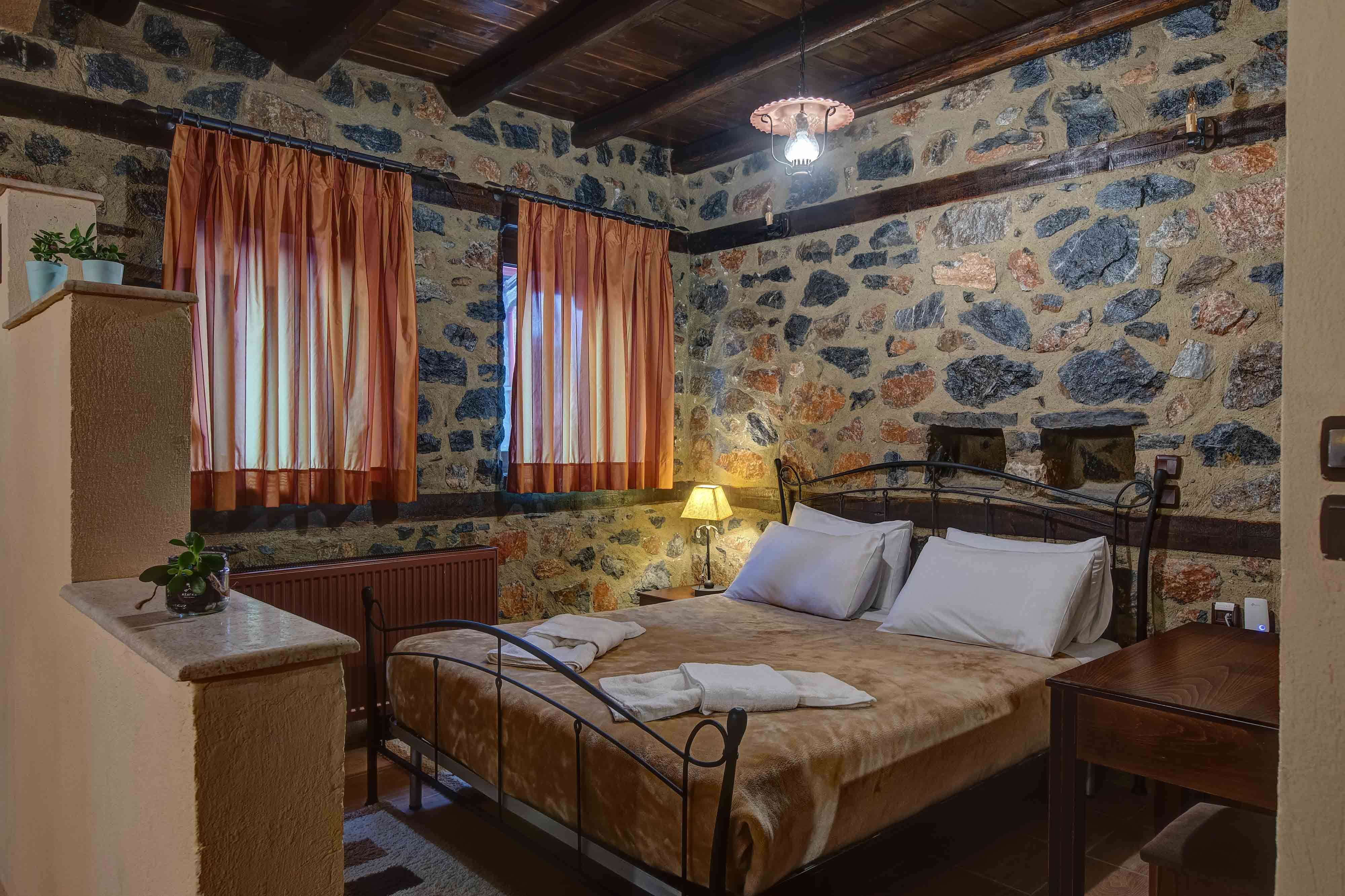 a bedroom with a bed and a desk