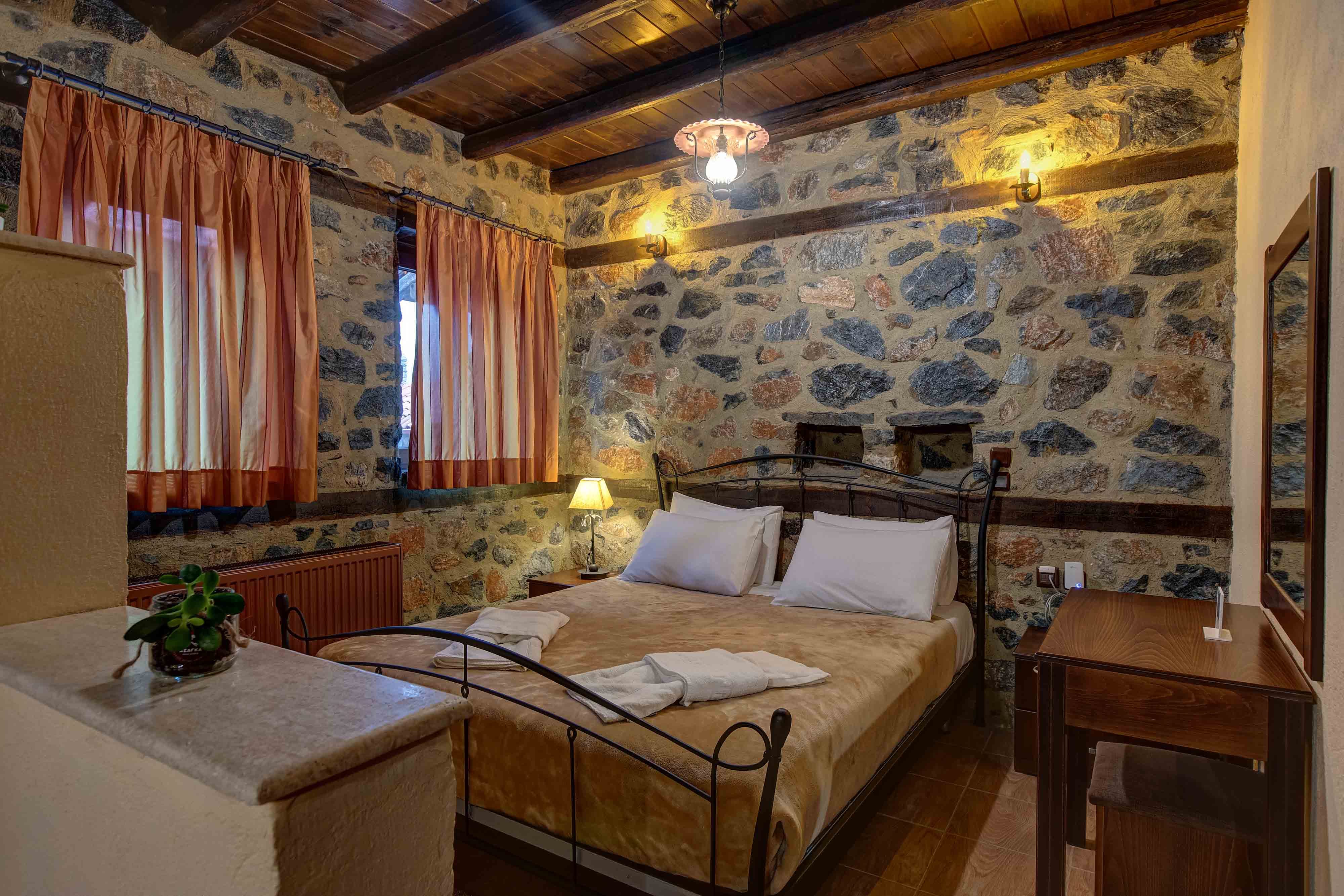 a bedroom with a bed and a desk