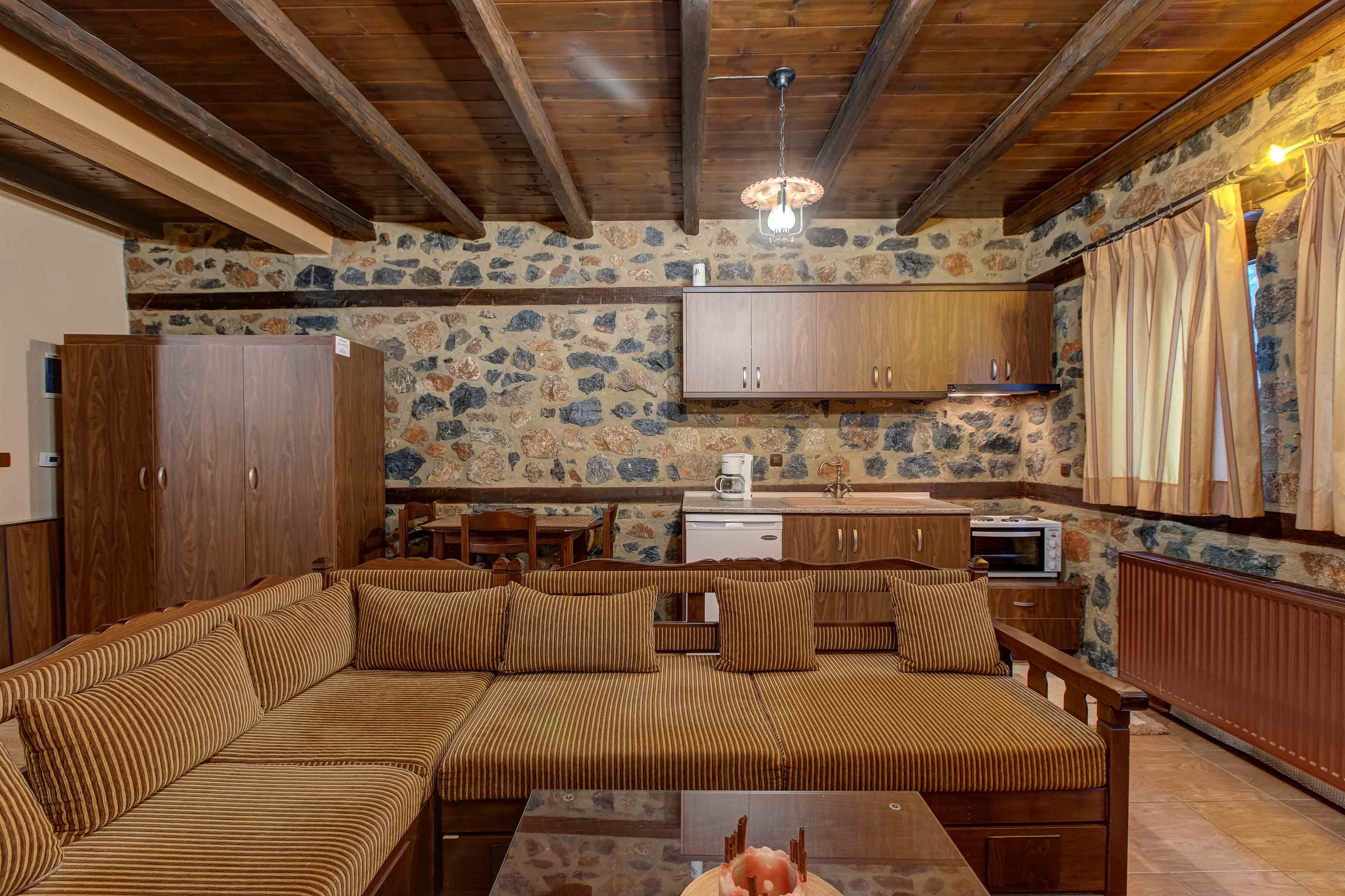 a large living room with a large couch and a table