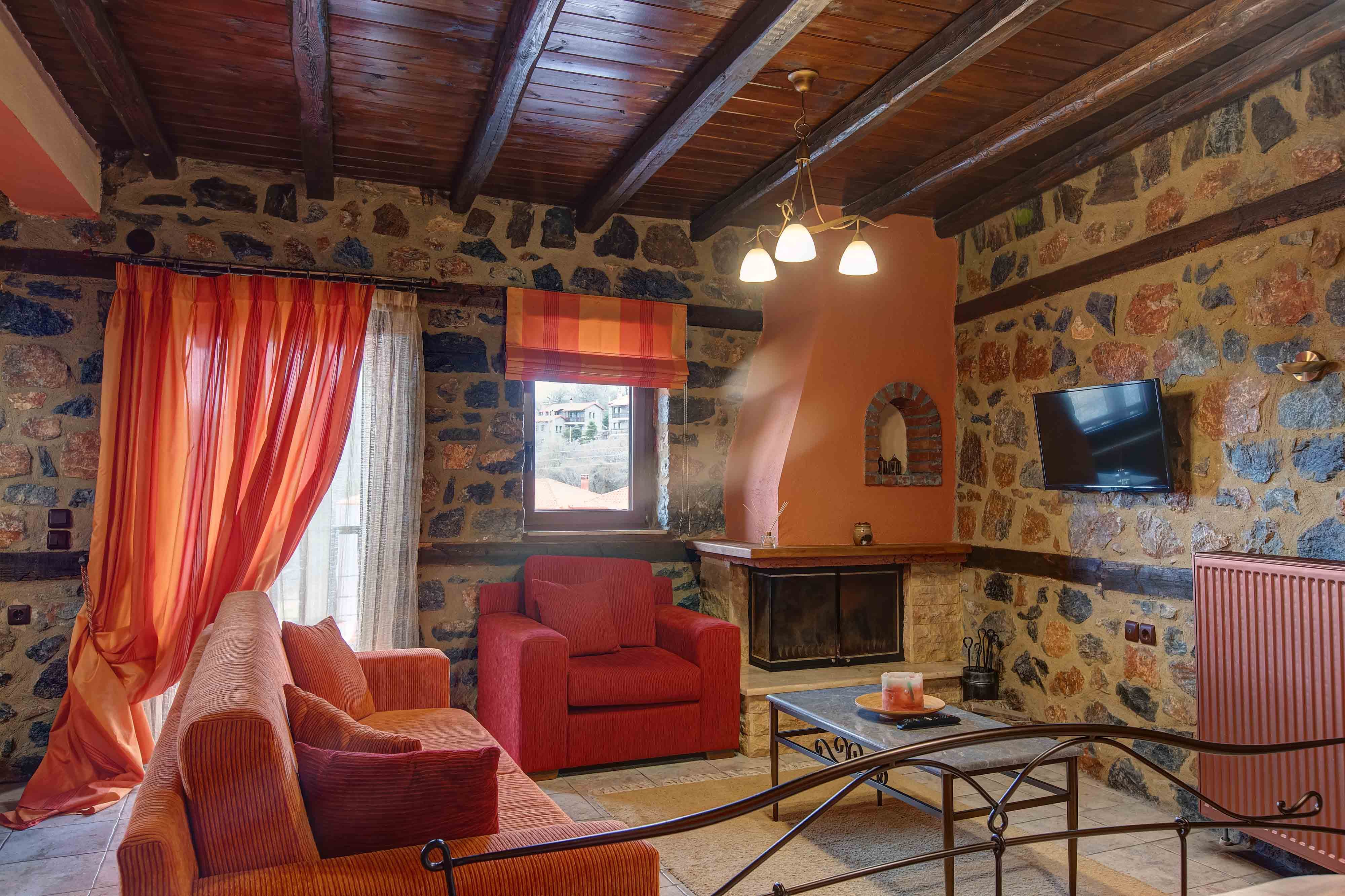 a living room with red chairs