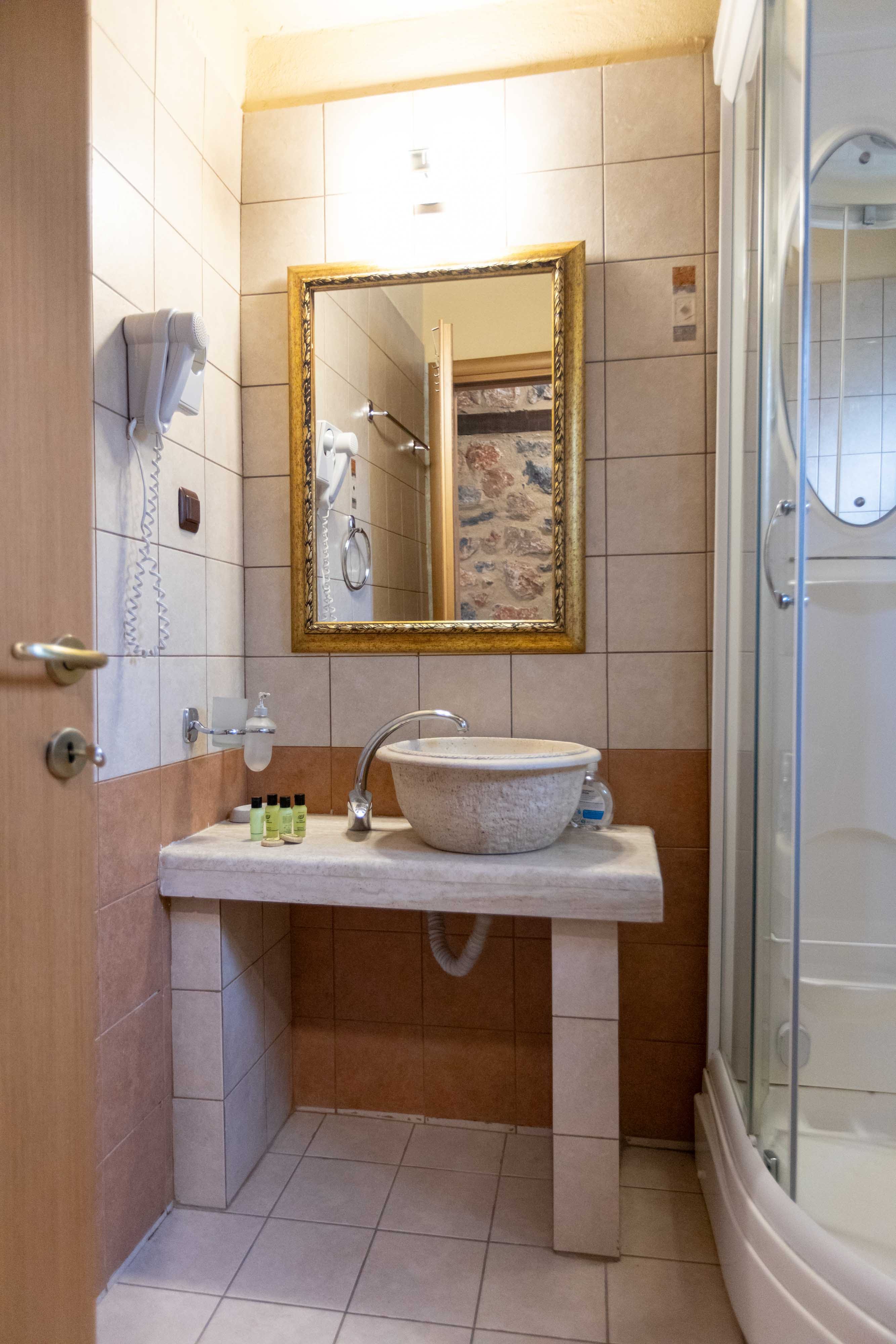 a bathroom with a mirror and sink