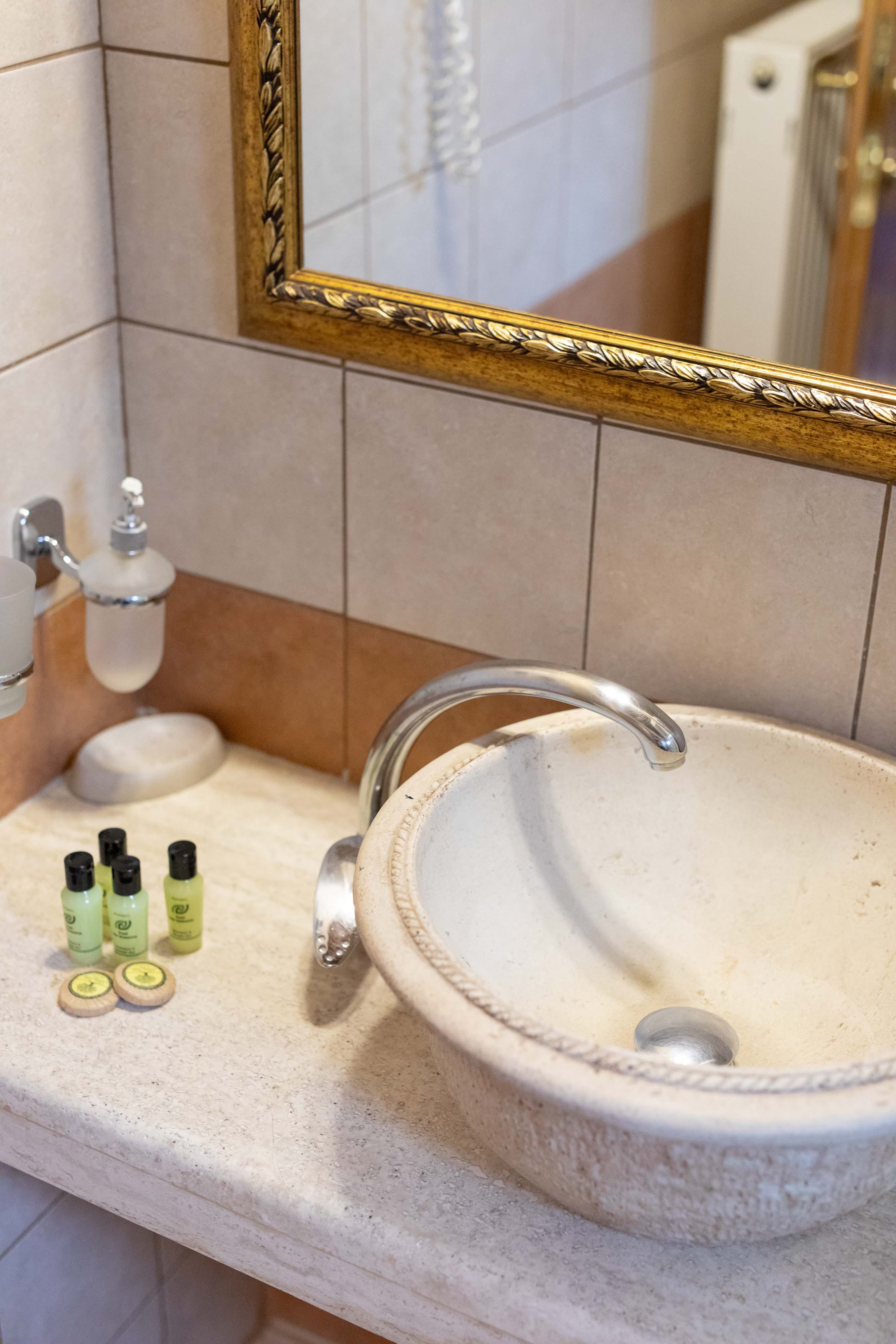 a bathroom sink with a mirror above it