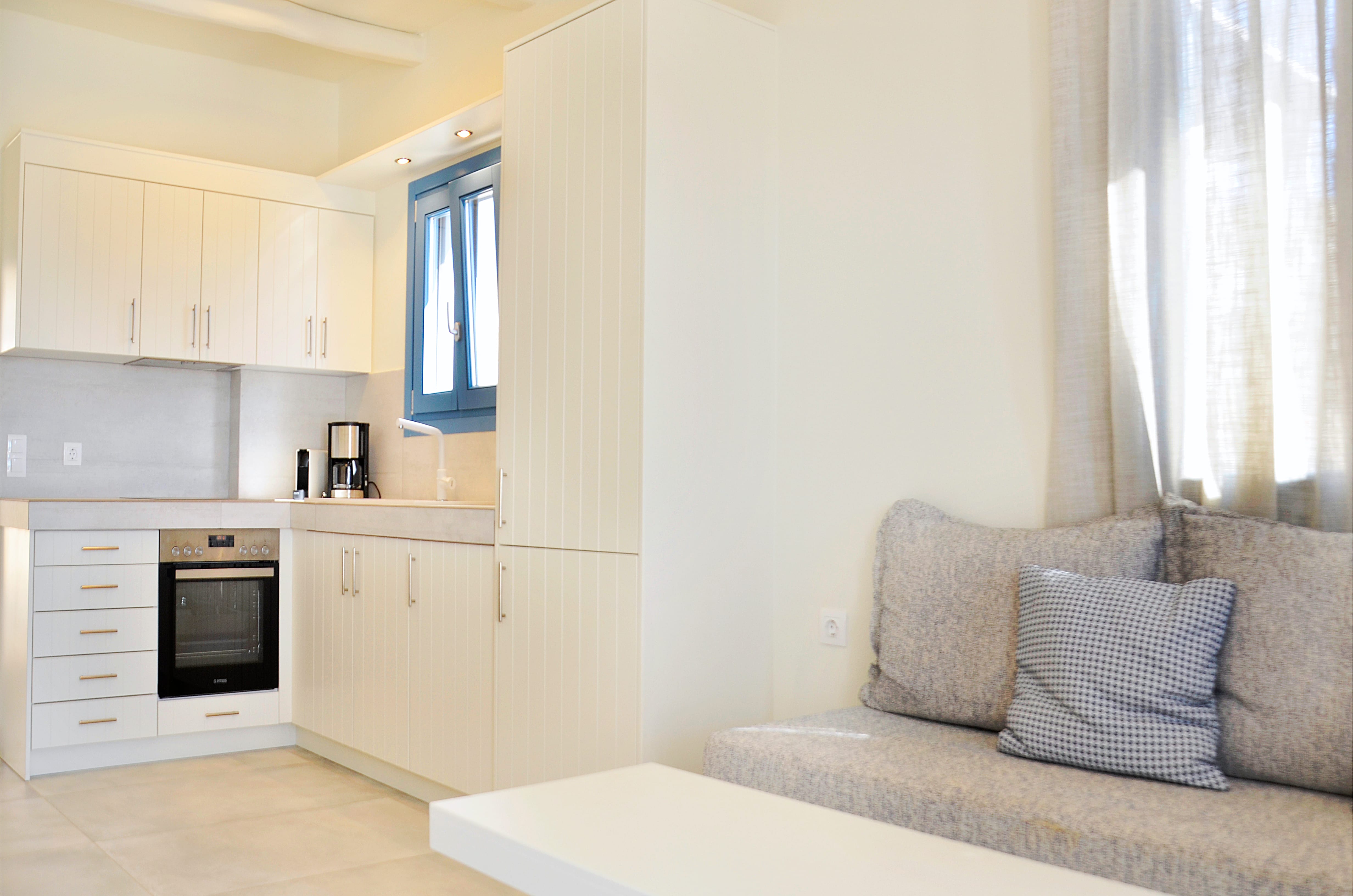 a living room with white cabinets