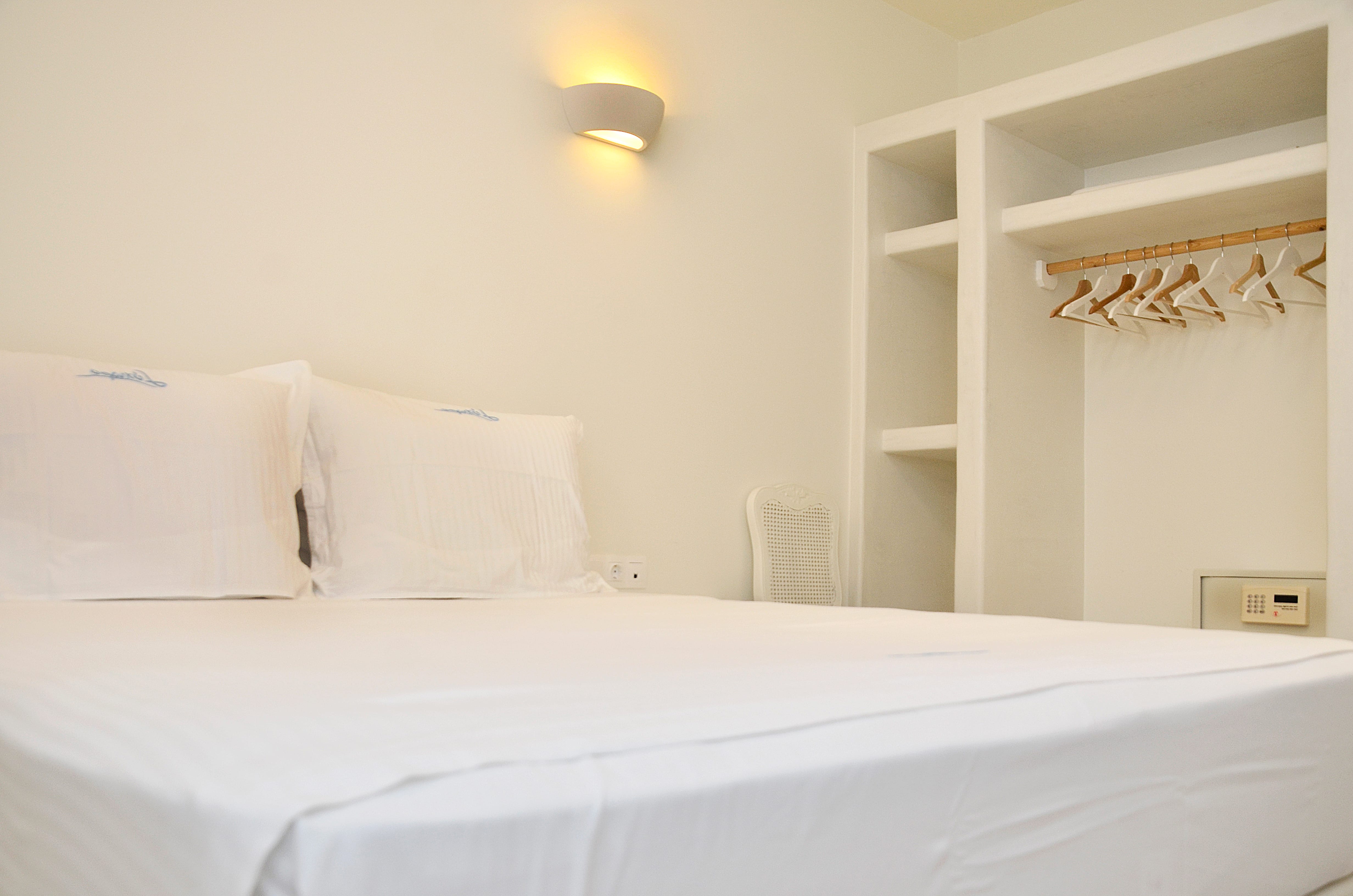 a bed with white sheets