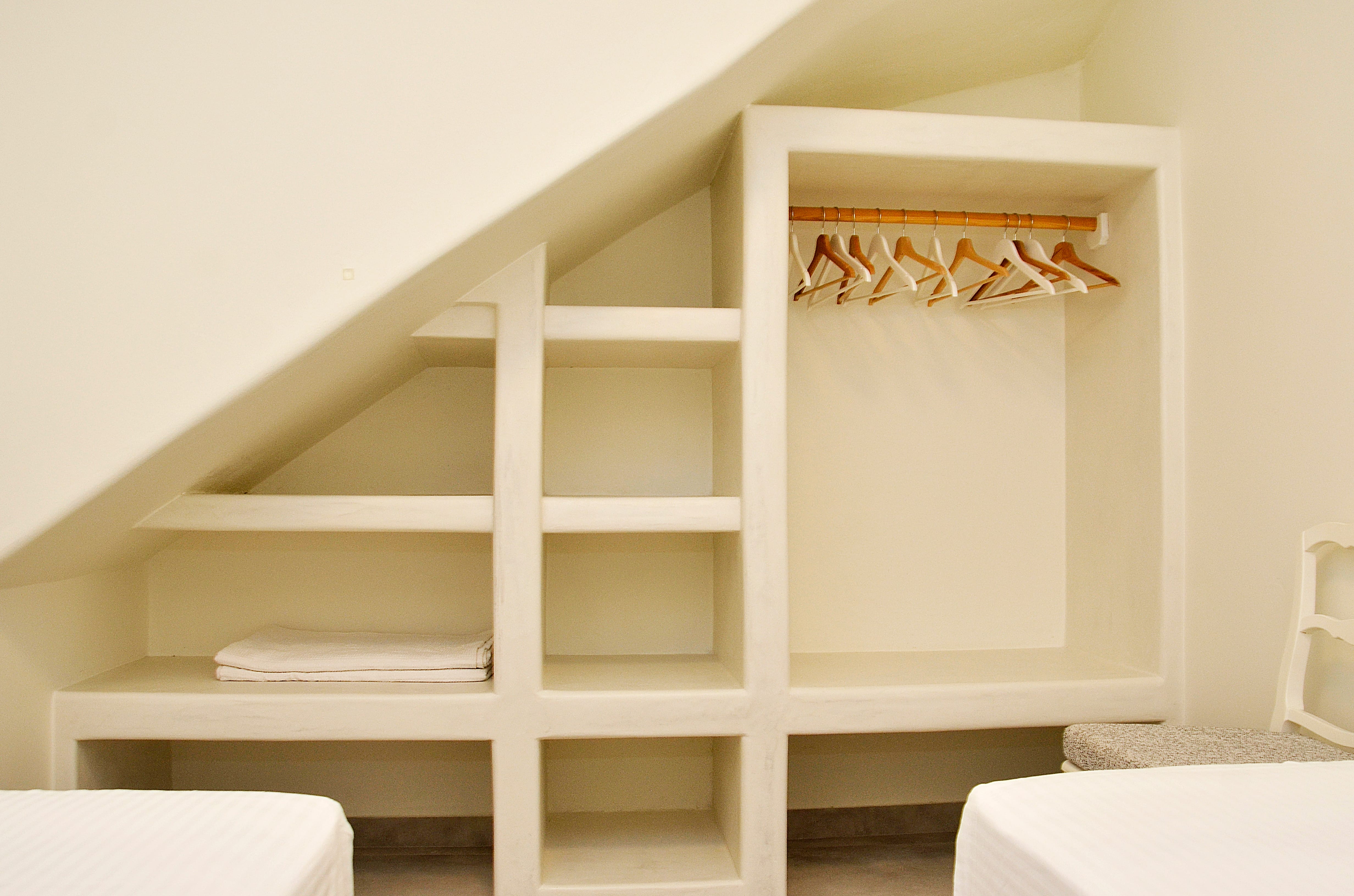 a white shelf with a bookcase
