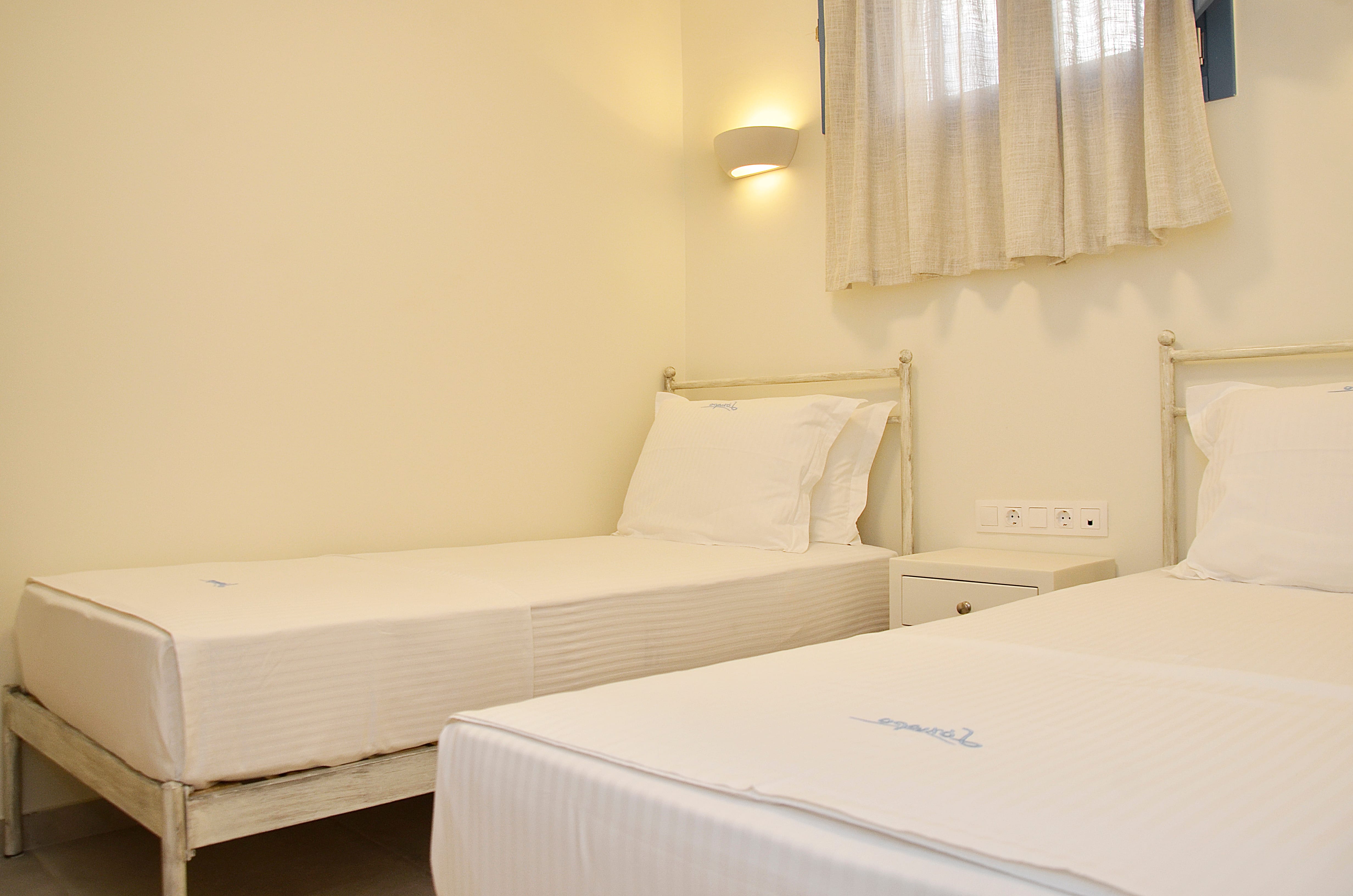 a couple of beds in a room