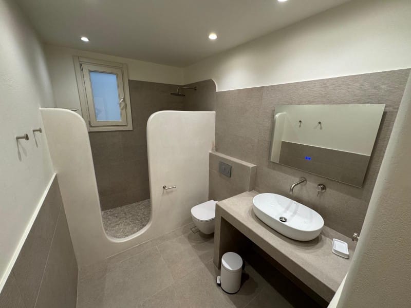 a bathroom with a tub sink and toilet