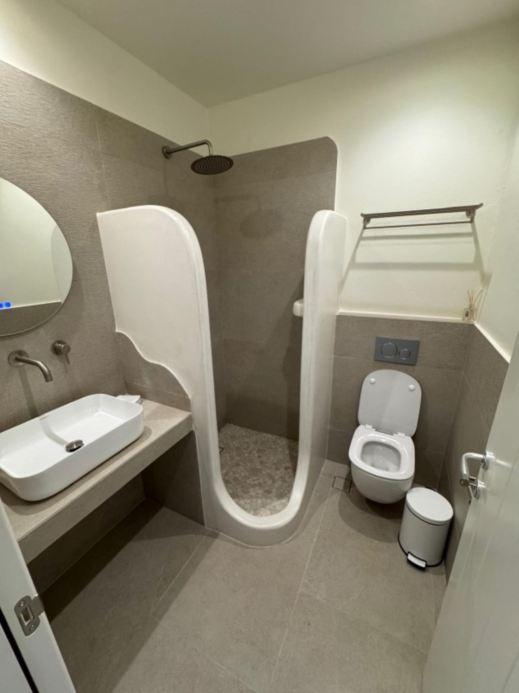 a bathroom with a shower and sink