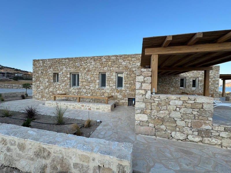 a stone building with a stone wall