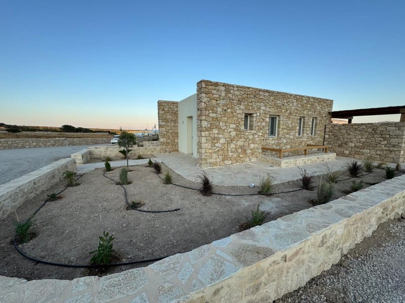 a stone building with a stone wall