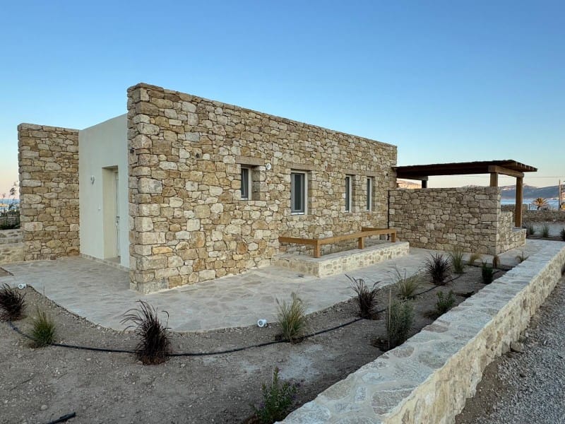 a stone building with a stone walkway