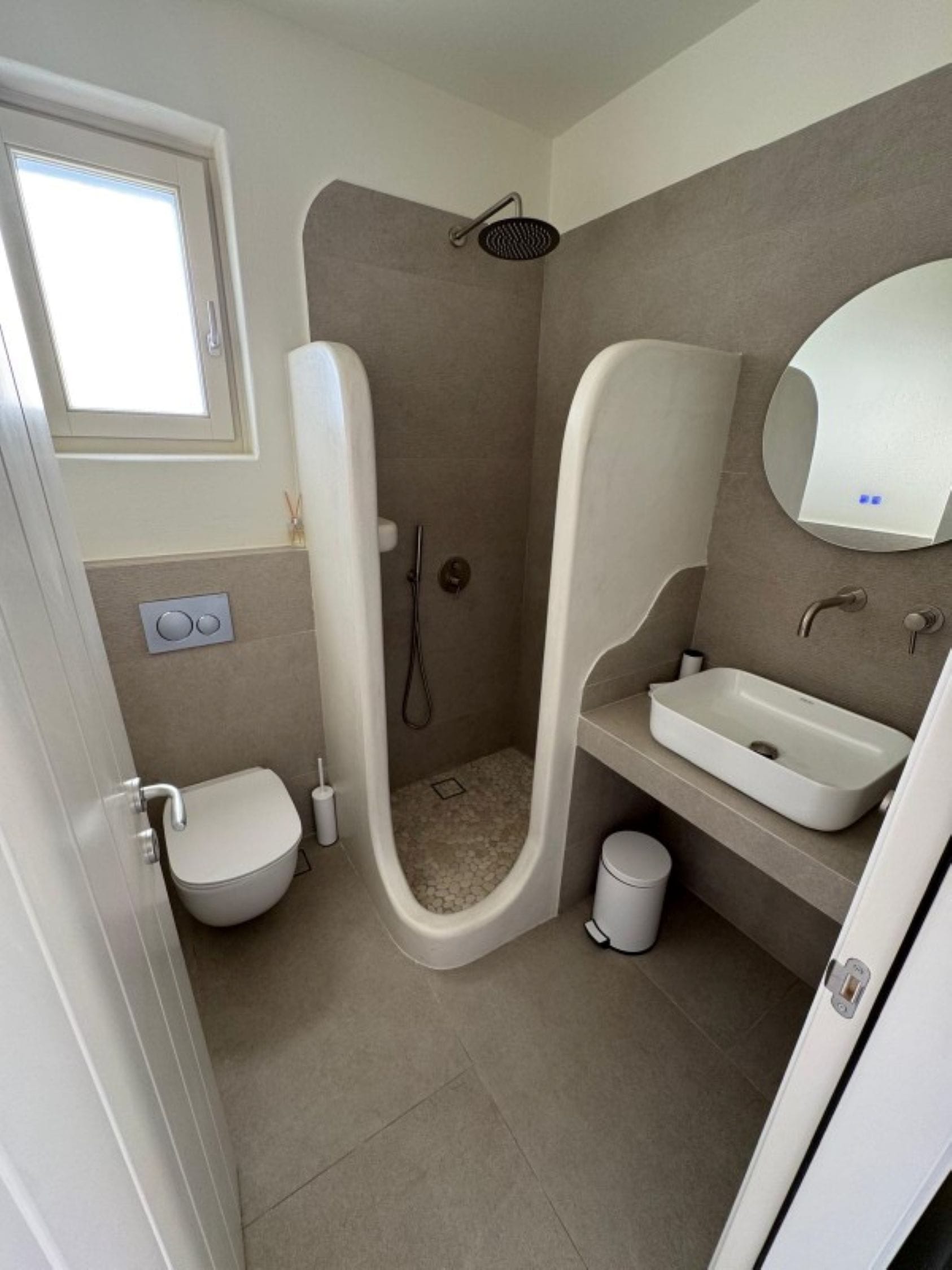 a bathroom with a toilet and sink