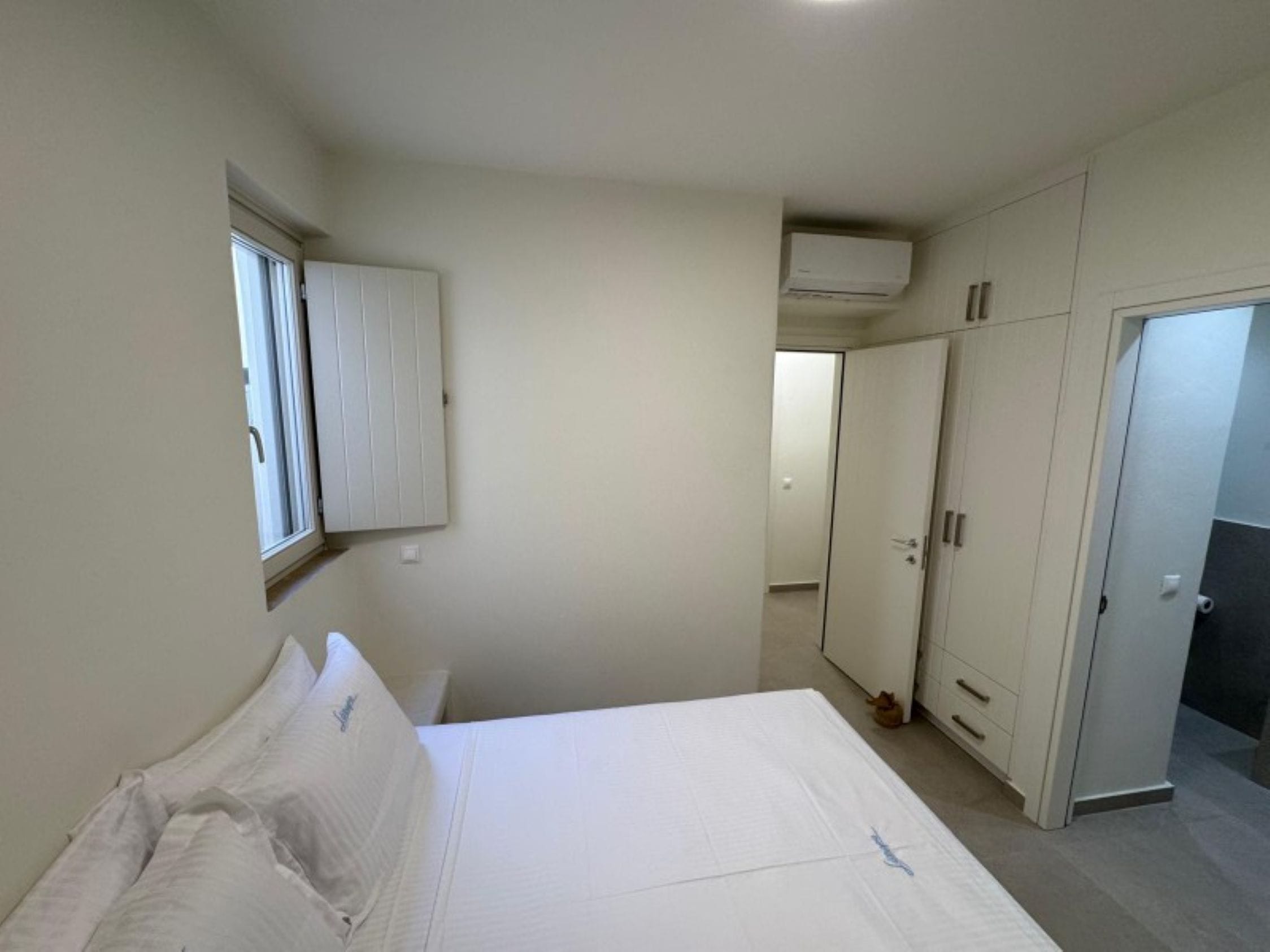 a room with a bed and a door