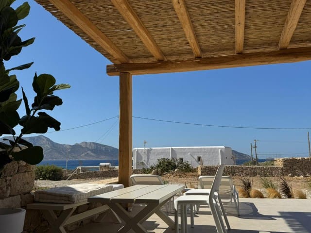 a patio with tables and chairs