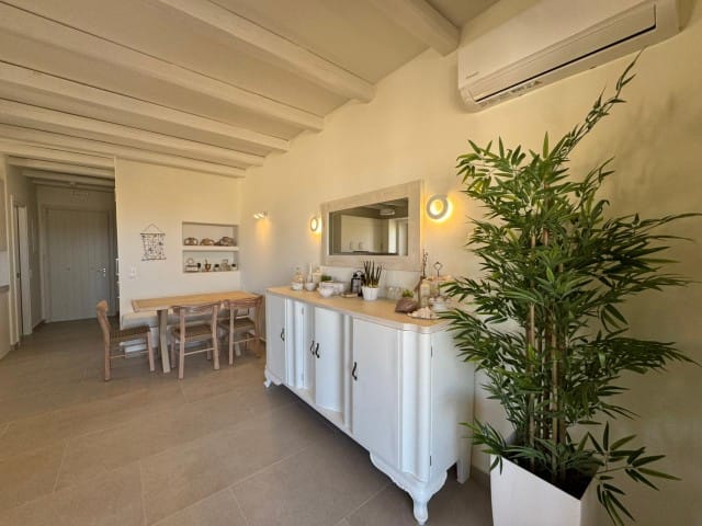 a room with a table and chairs