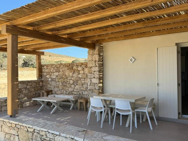 a patio with tables and chairs