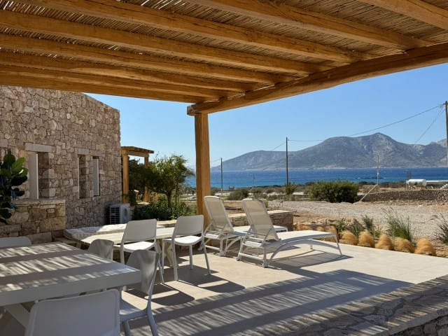 a patio with tables and chairs