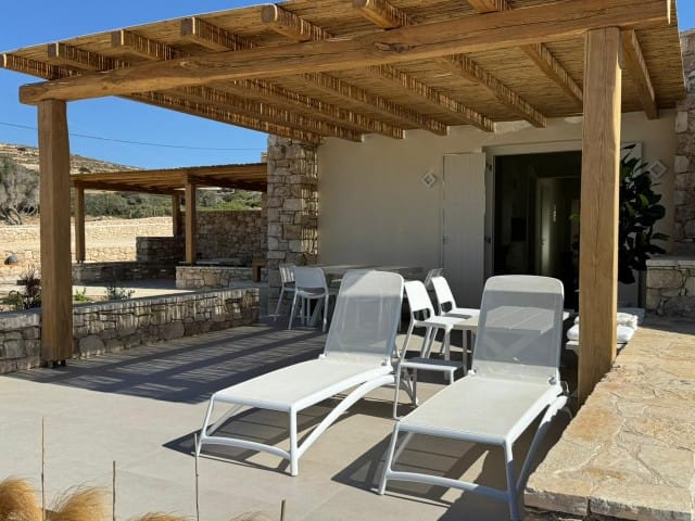 a patio with chairs and tables