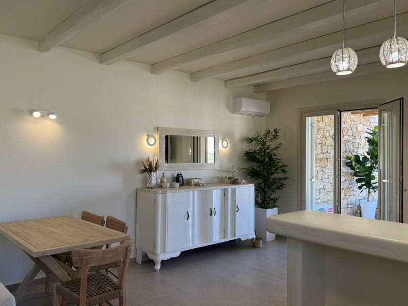 a kitchen with a table and chairs
