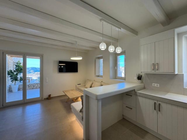 a large kitchen with white cabinets