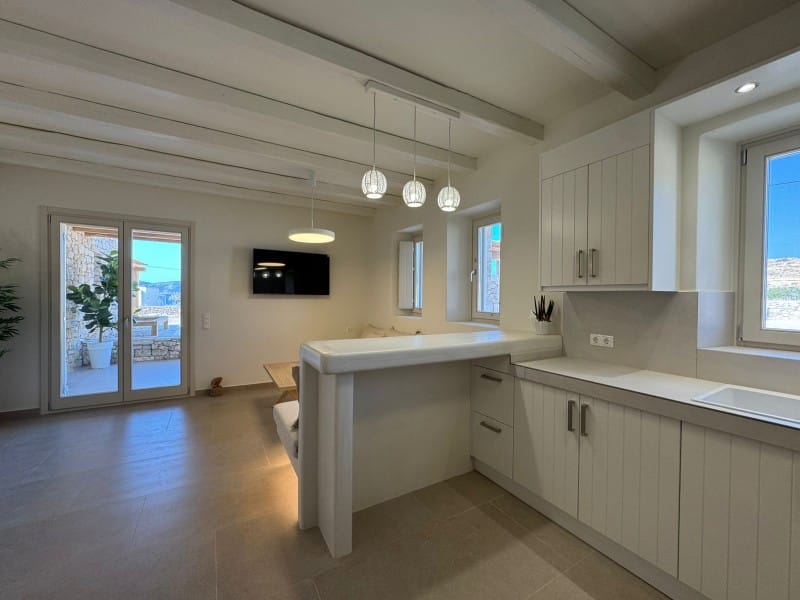 a kitchen with white cabinets