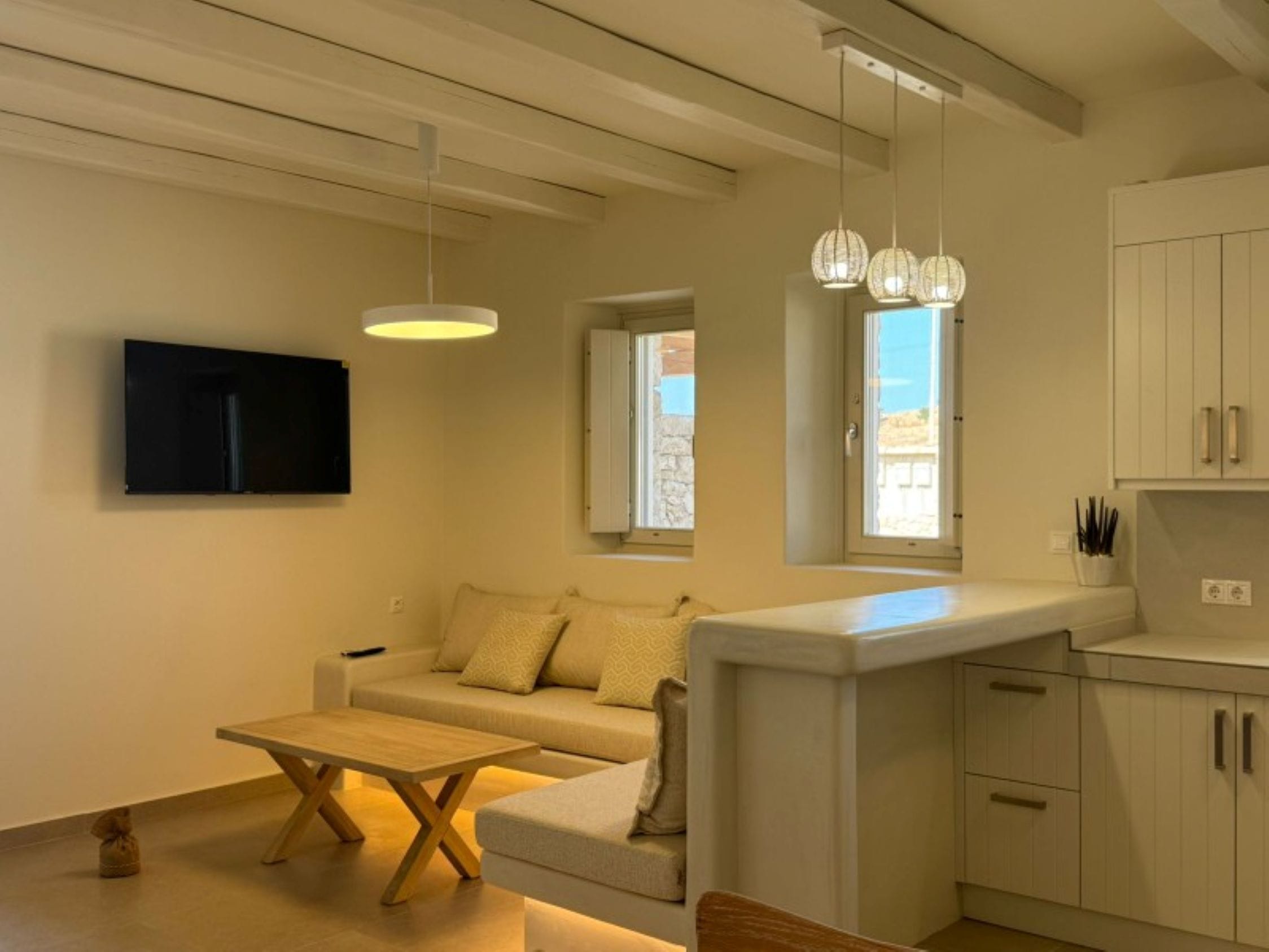 a living room with a tv and couches