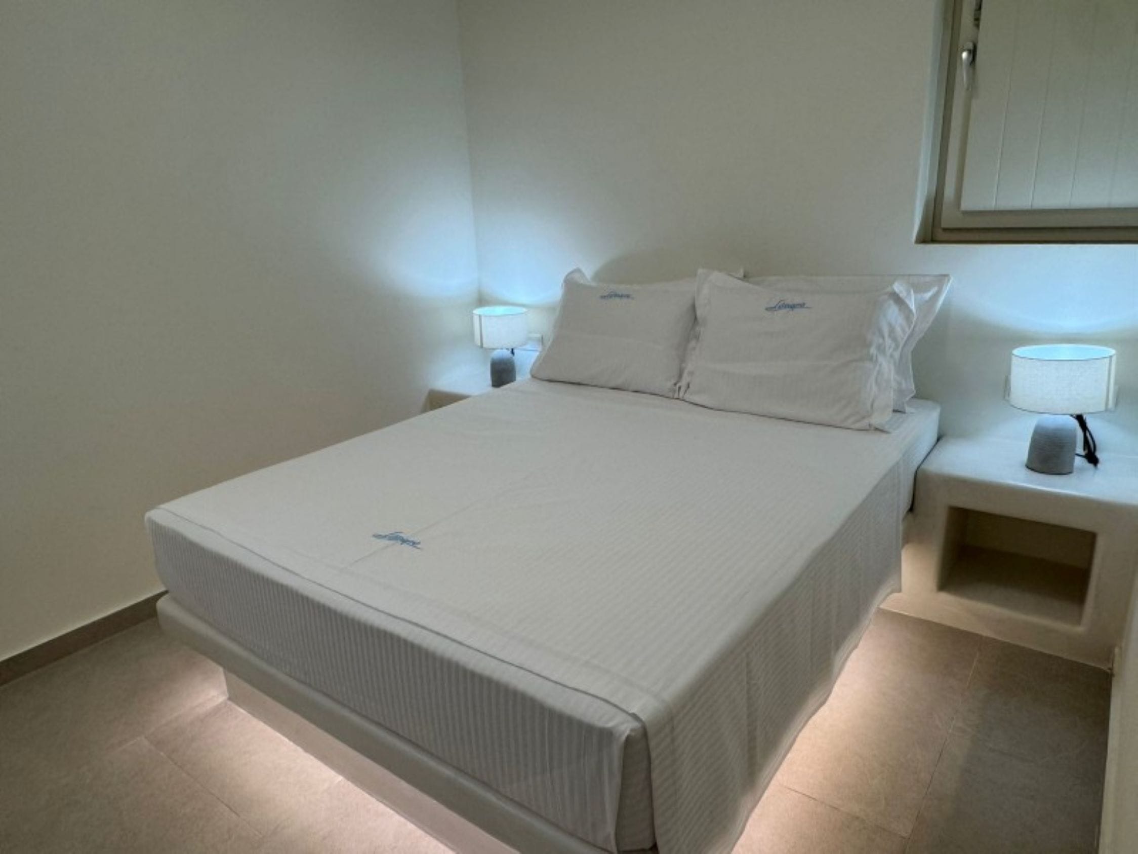 a bed with white sheets