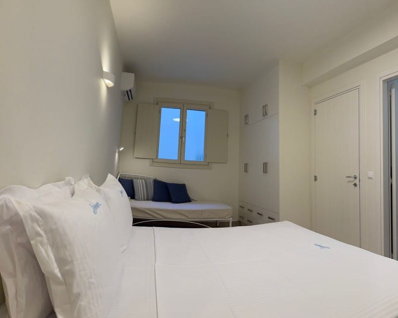 a room with a bed and a window