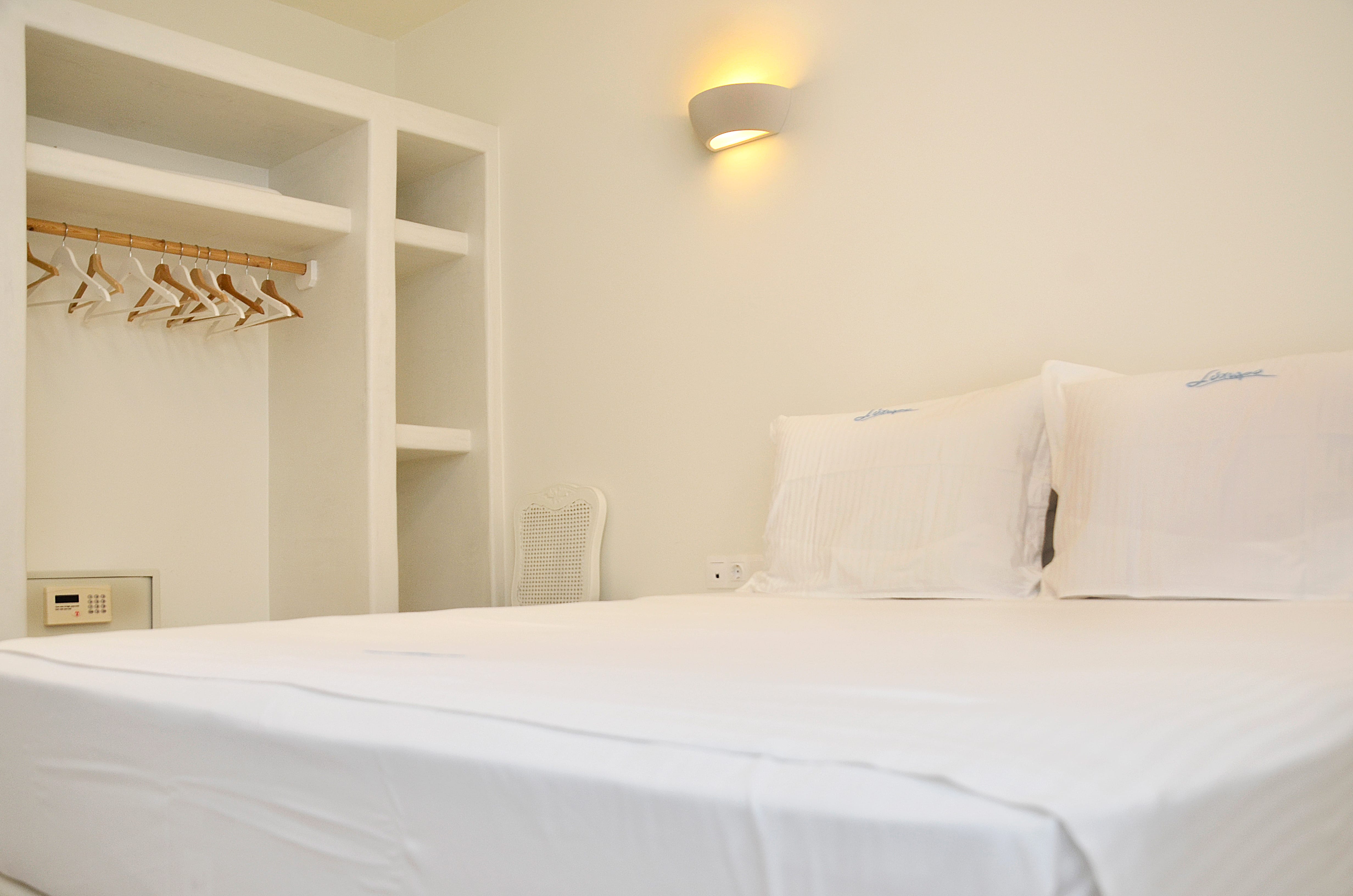 a bed with white sheets