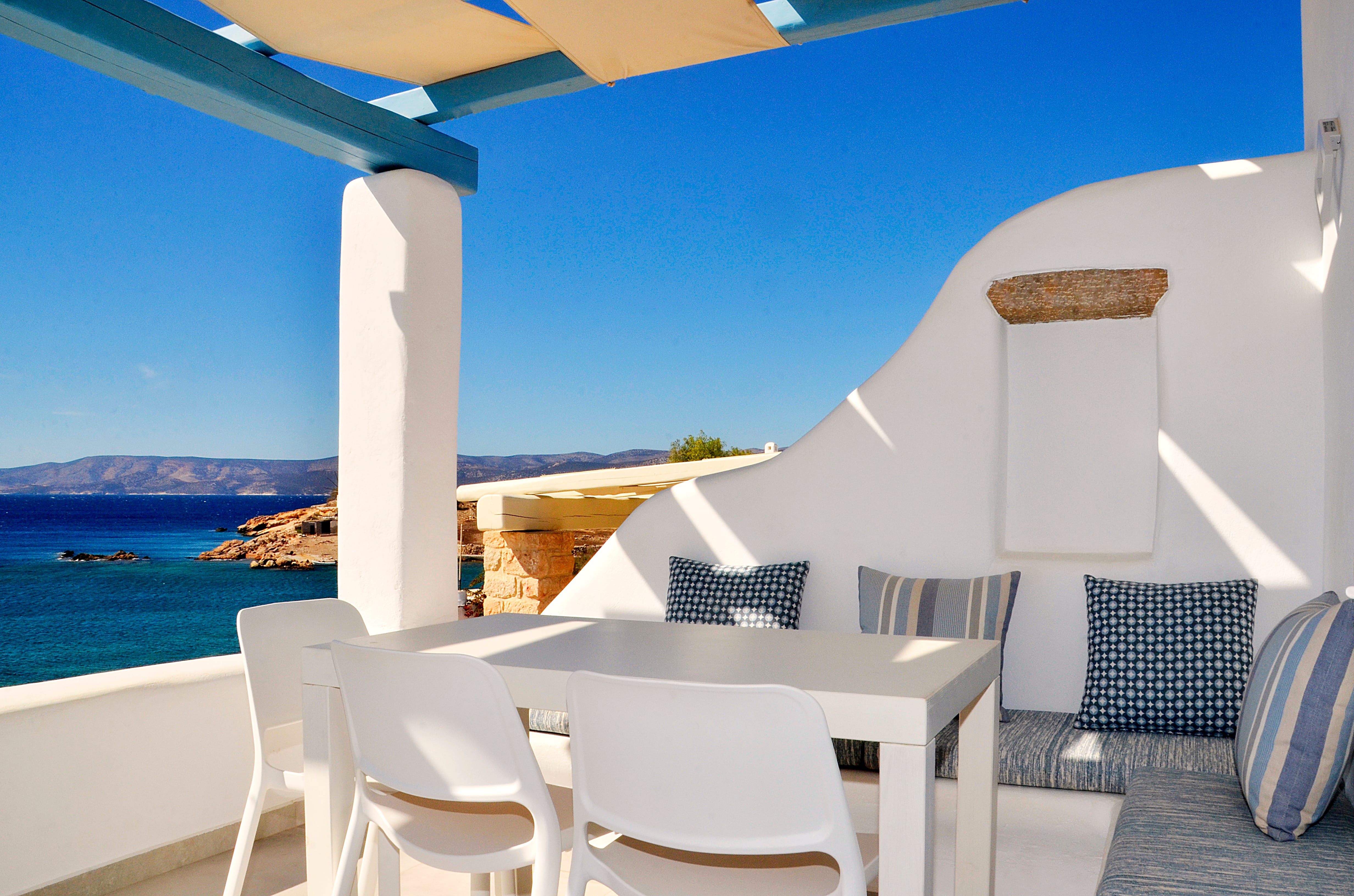 a table and chairs on a balcony