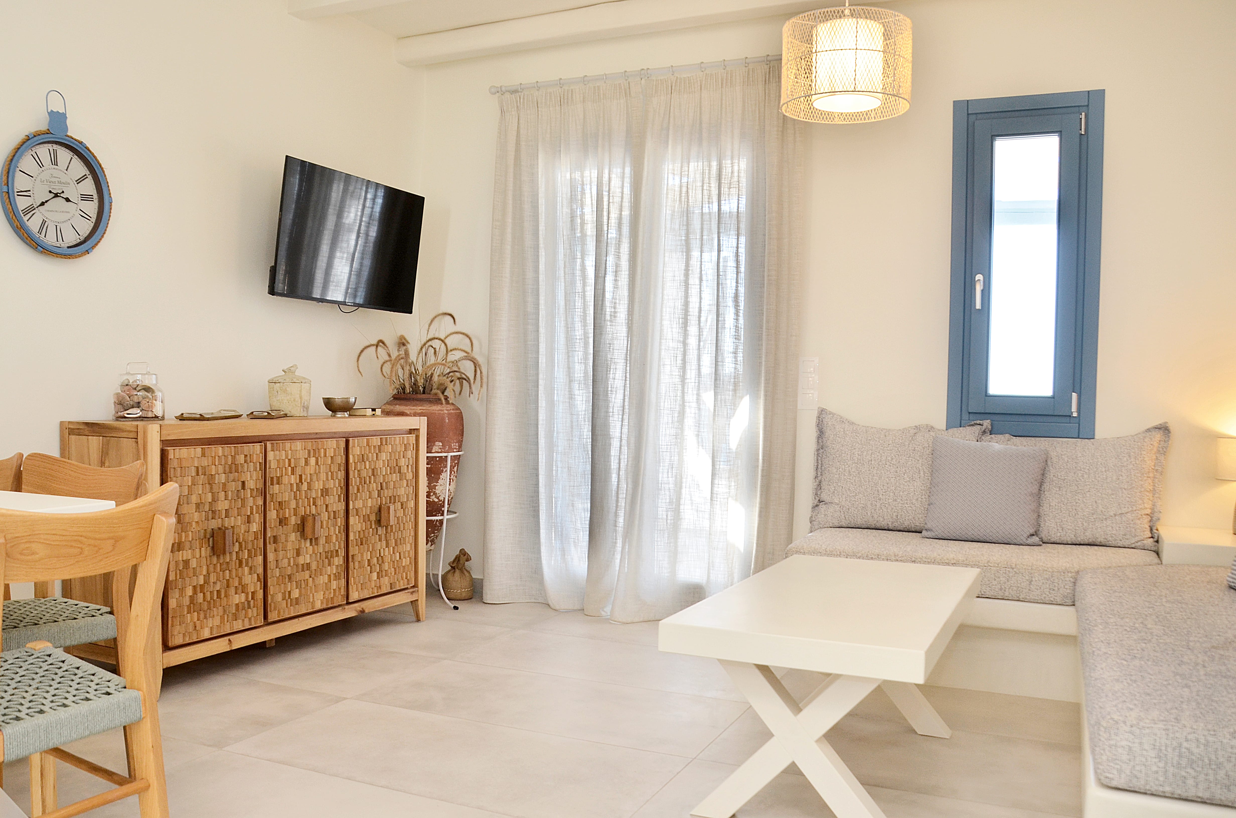 a living room with a white couch and a table