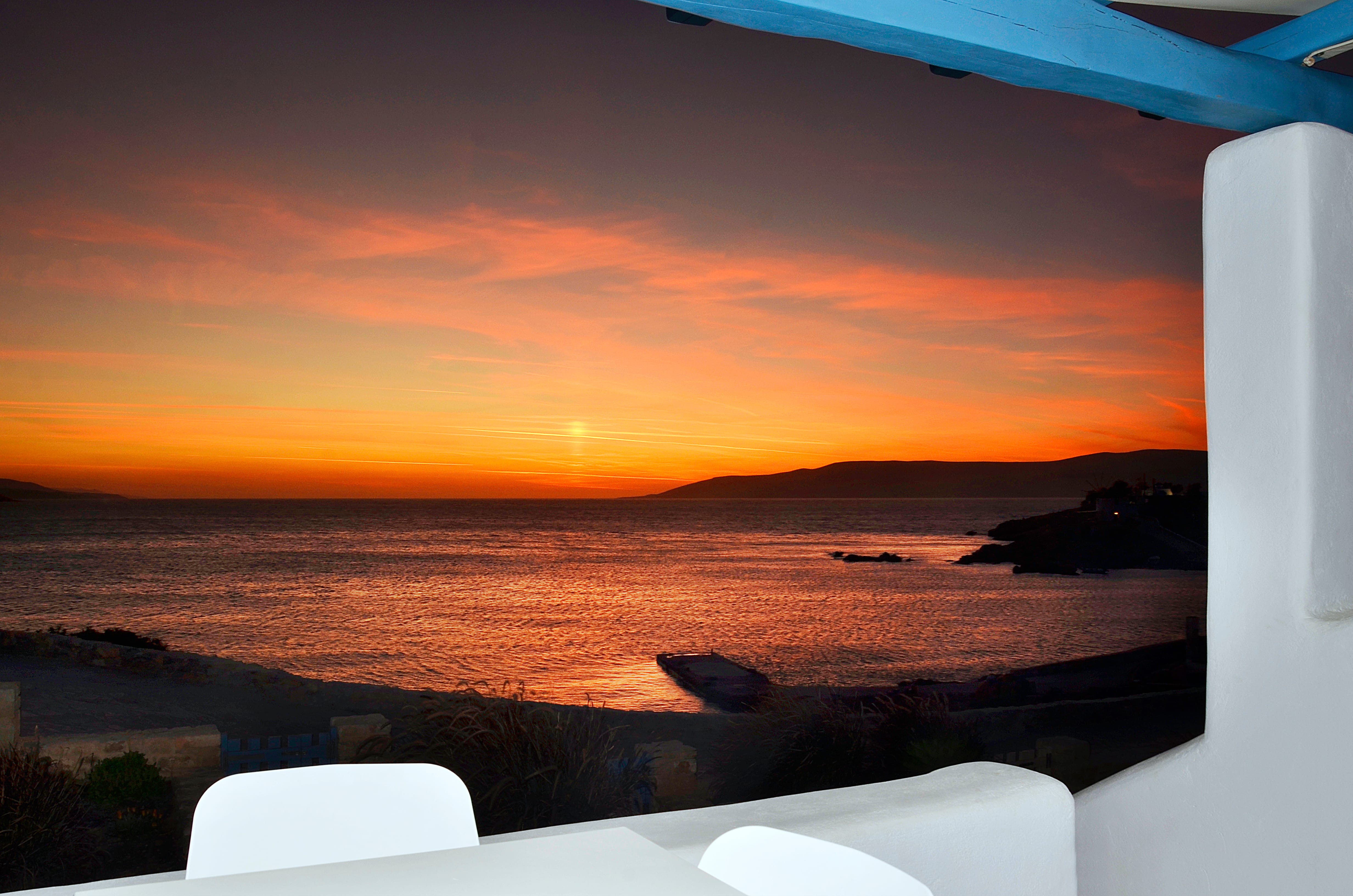a sunset over a body of water