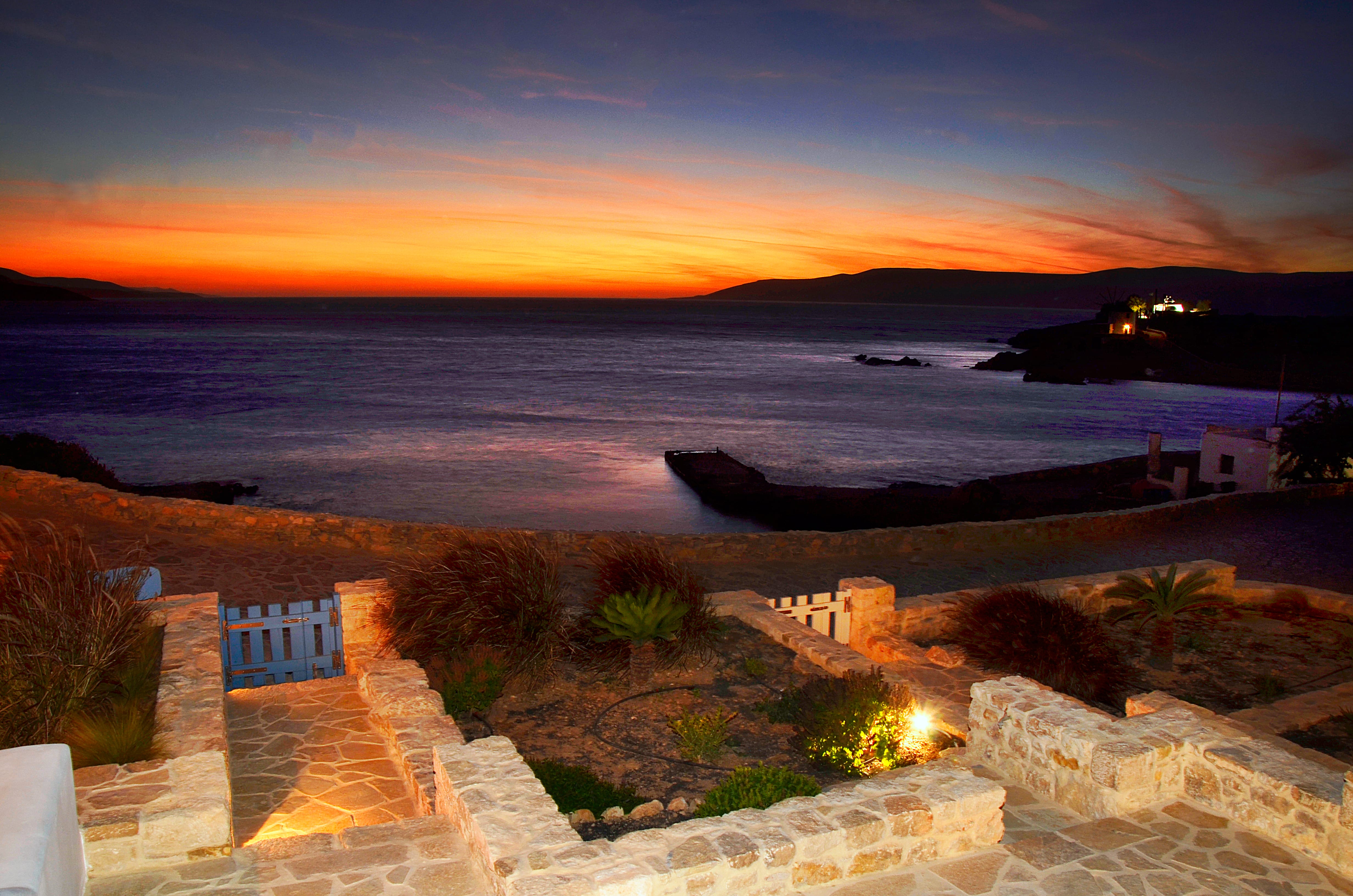 a beach with a sunset