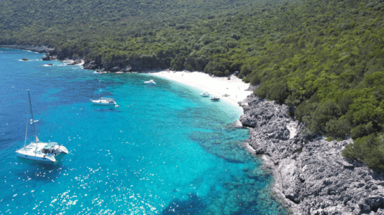 a blue lagoon with boats