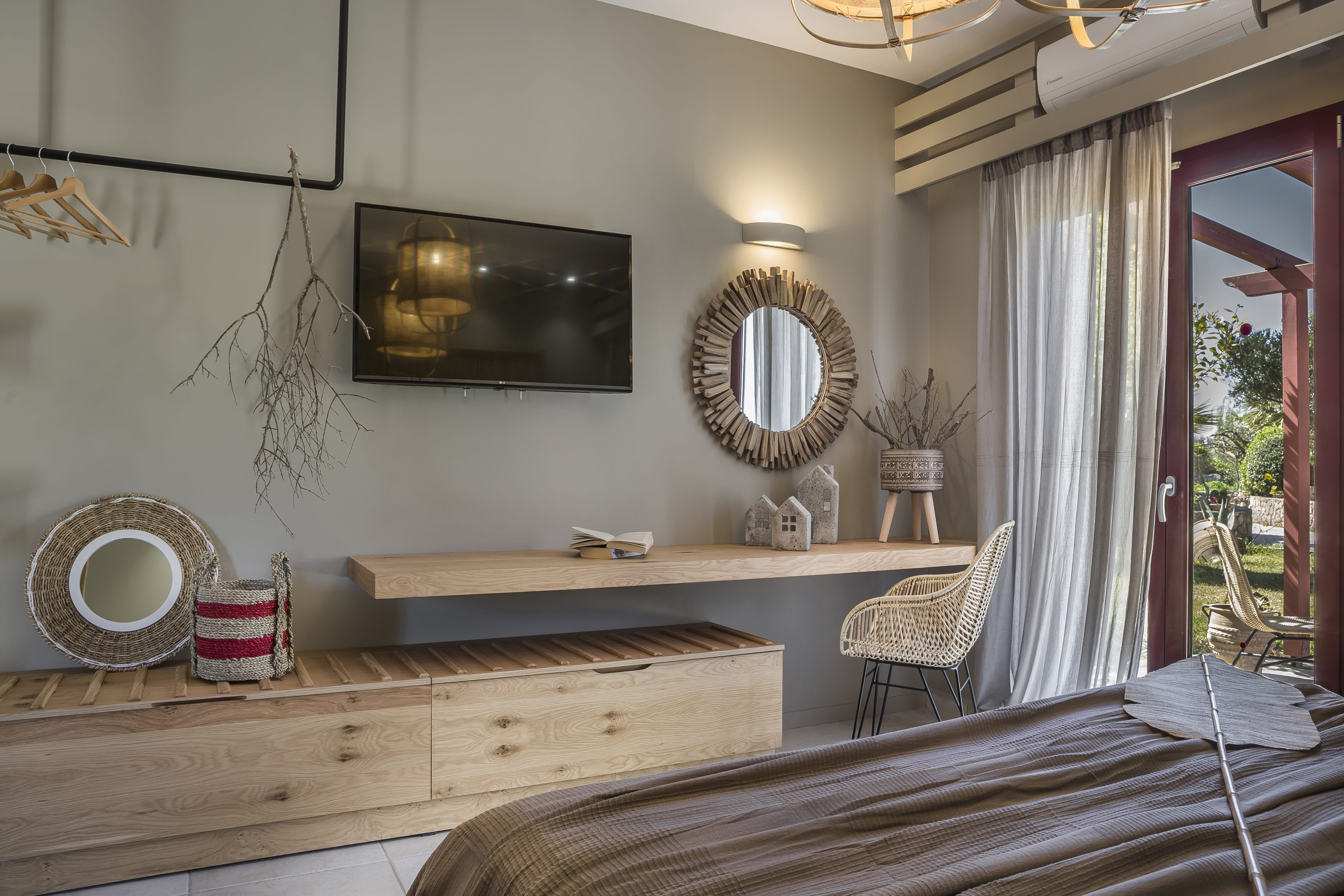 a bathroom with a mirror and a bench