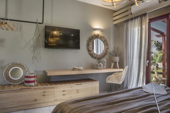 a bathroom with a mirror and a bench