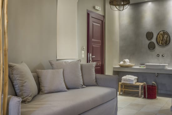 a living room with a couch and a sink