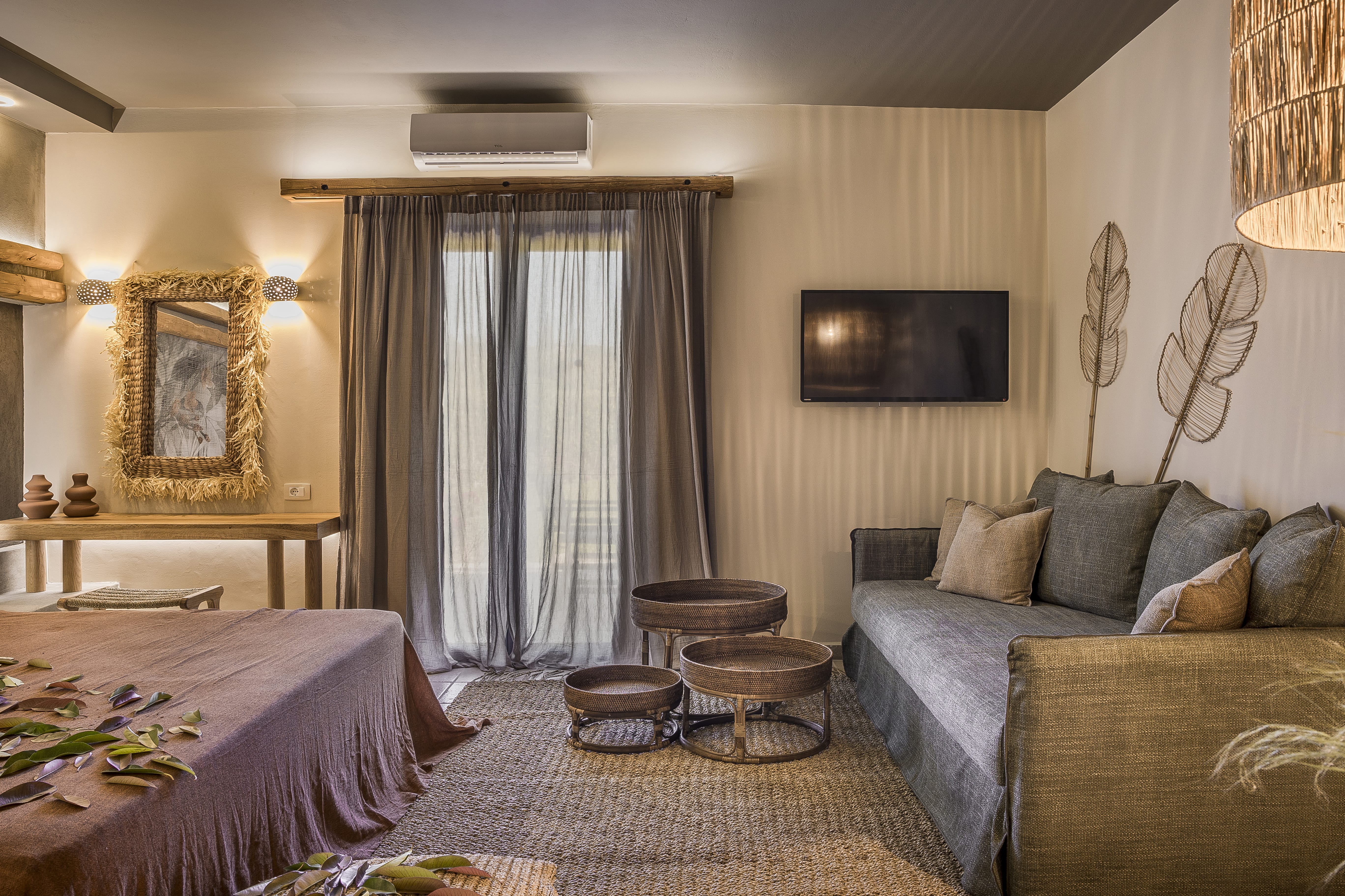 a bedroom with a bed and a couch