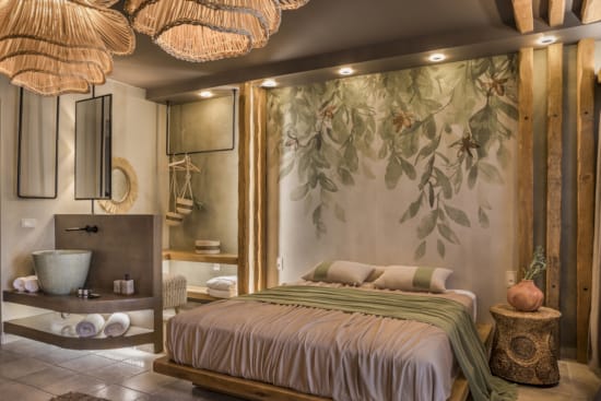 a bedroom with a bed and a mirror