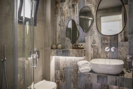 a bathroom with a couple of mirrors