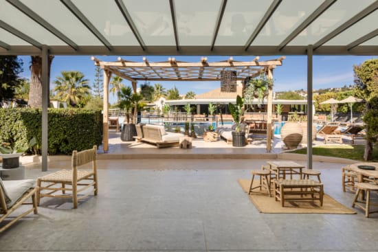 a patio with chairs and tables